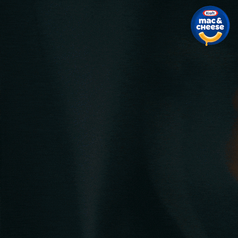 Kraft Mac & Cheese package with a dark background and the logo in the top right corner.