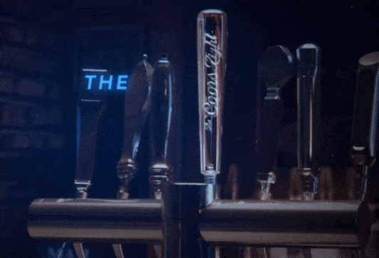 A close-up of the Coors Light beer tap in a bar.