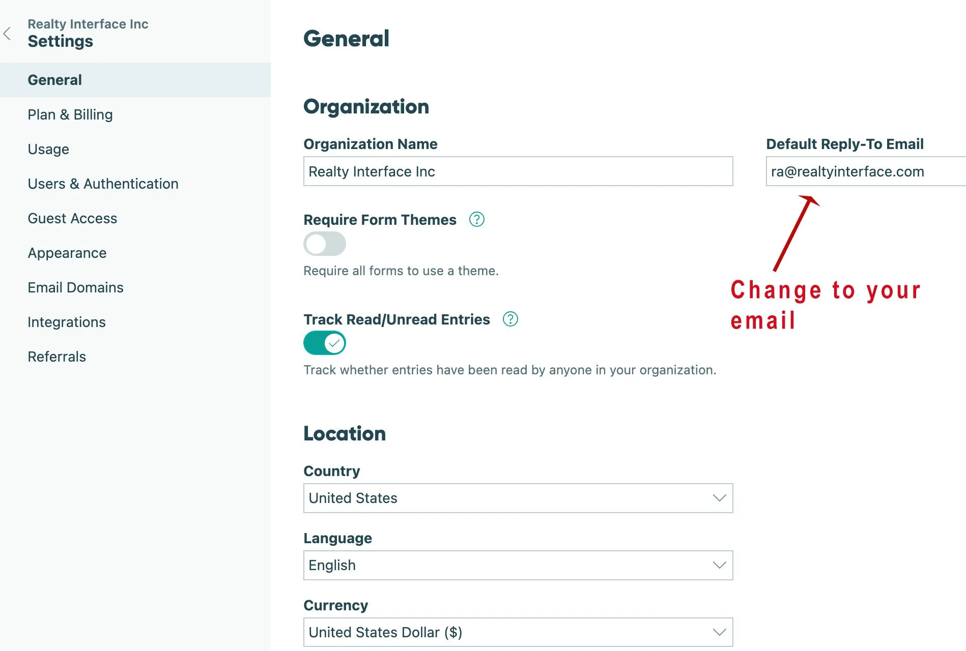 Screenshot of a settings page in a software application. It shows the 'General' section under 'Organization' with the organization name 'Reatly Interface Inc', default reply-to email 'ra@realtyinterface.com', and options to change email, track read/unread entries, and set location, language, and currency. An annotation with an arrow points to the email field, saying 'Change to your email' in red text.