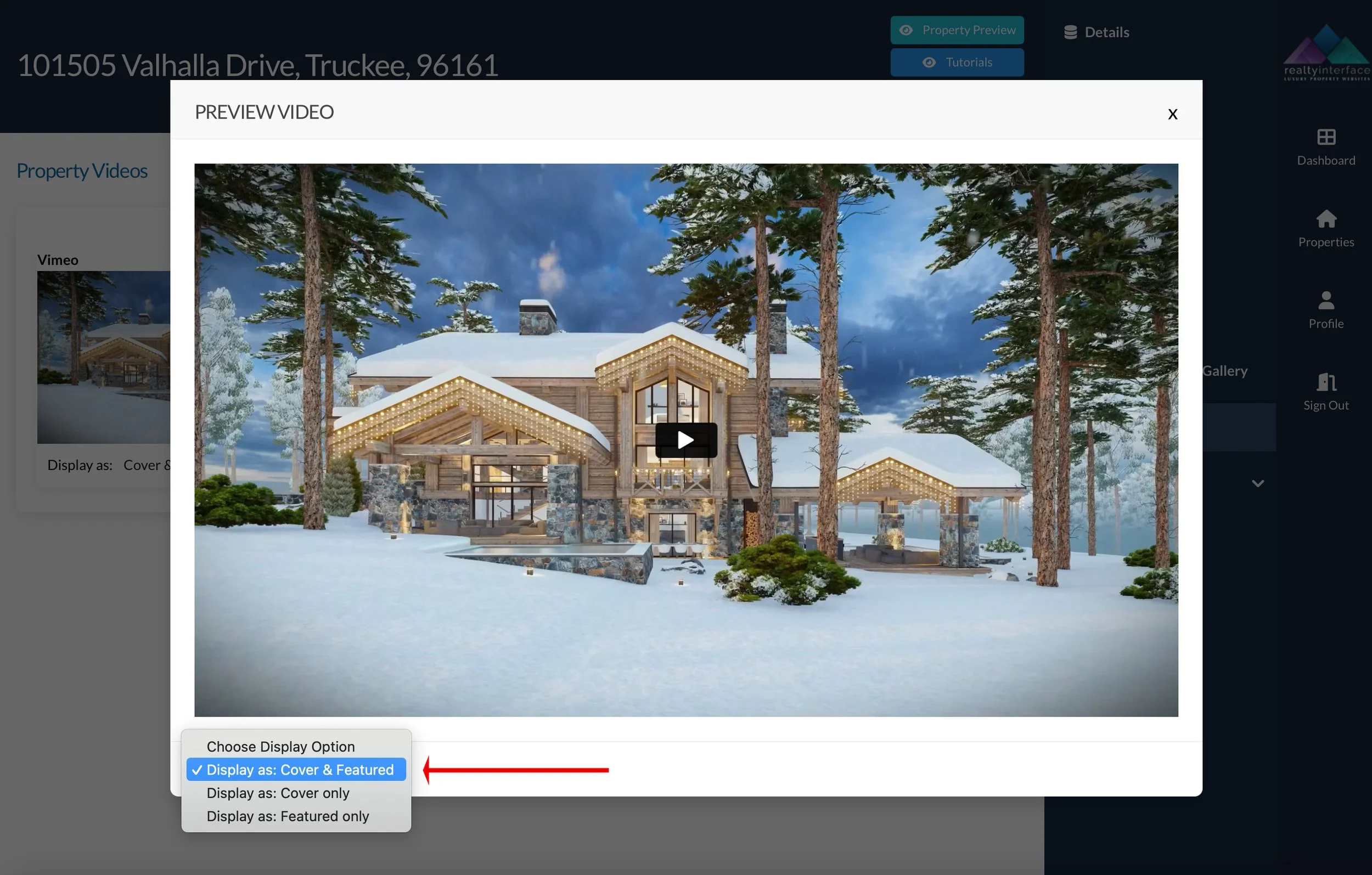 Preview video of a luxury cabin surrounded by snow and trees, featuring wood and stone architecture with a triangular roof. The scene conveys a wintery, mountain setting. Display options for the video are shown below the image.