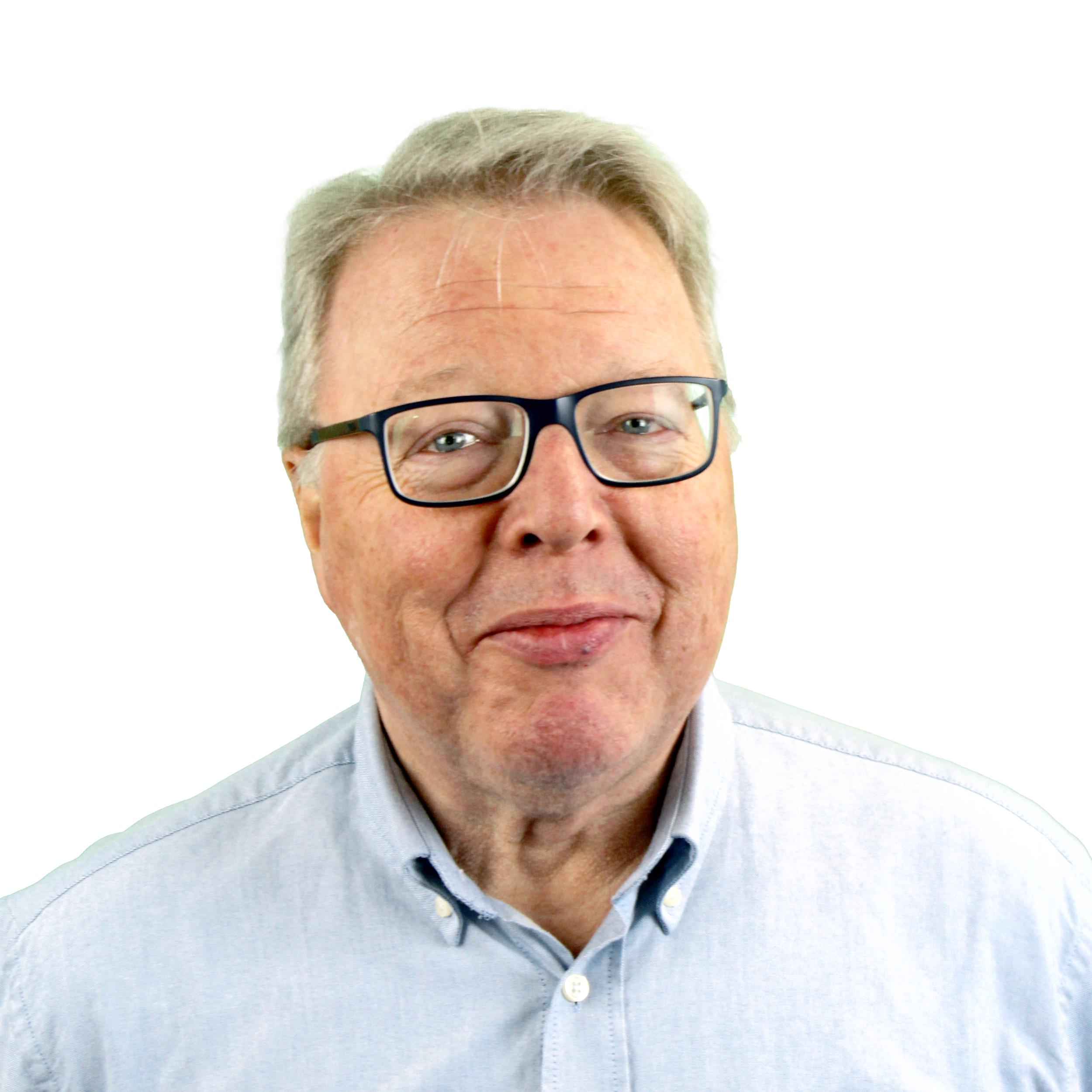 Close-up of a middle-aged man with gray hair, glasses, wearing a light blue collared shirt.