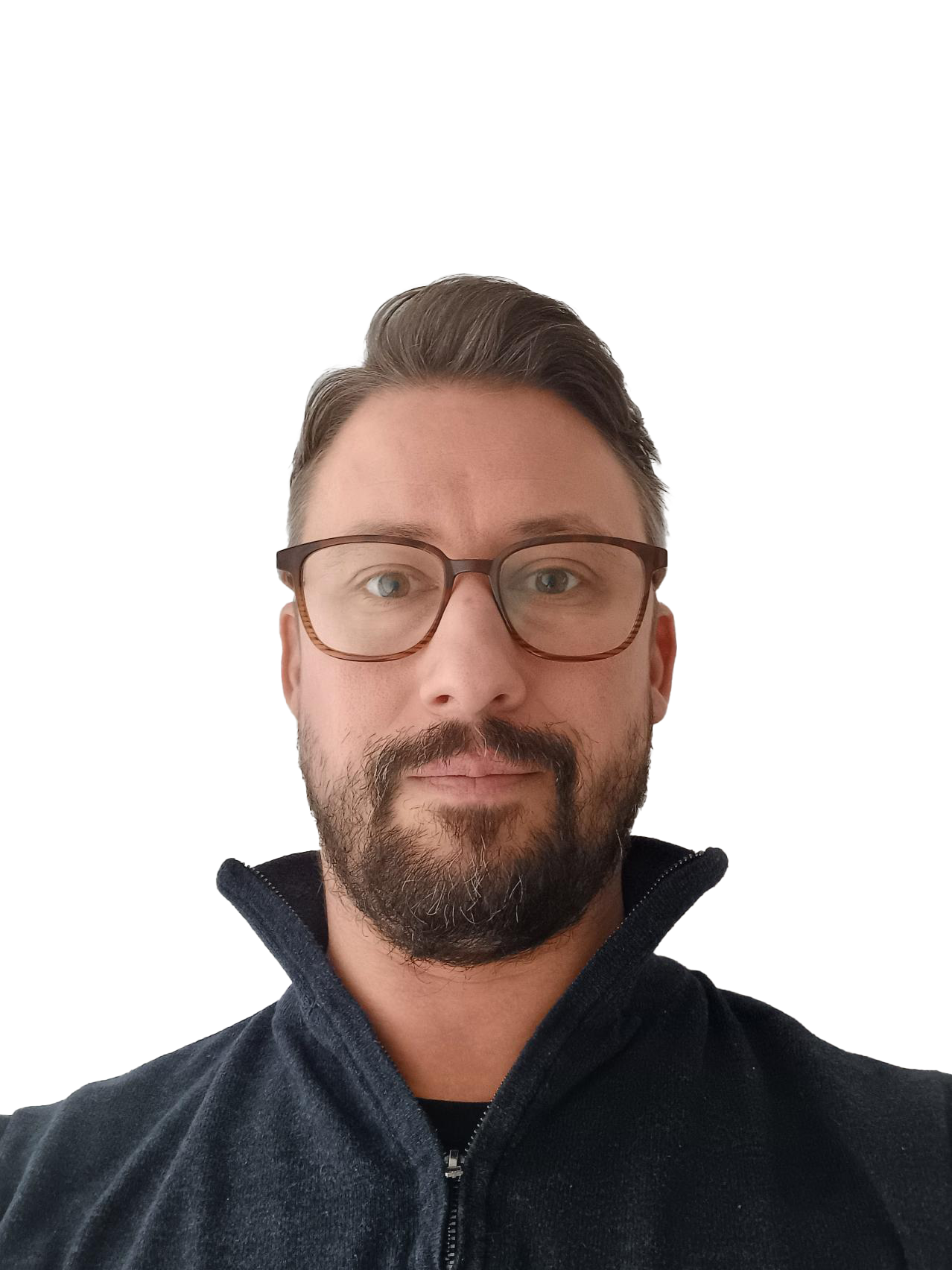 A man with glasses and facial hair taking a selfie against a white background.