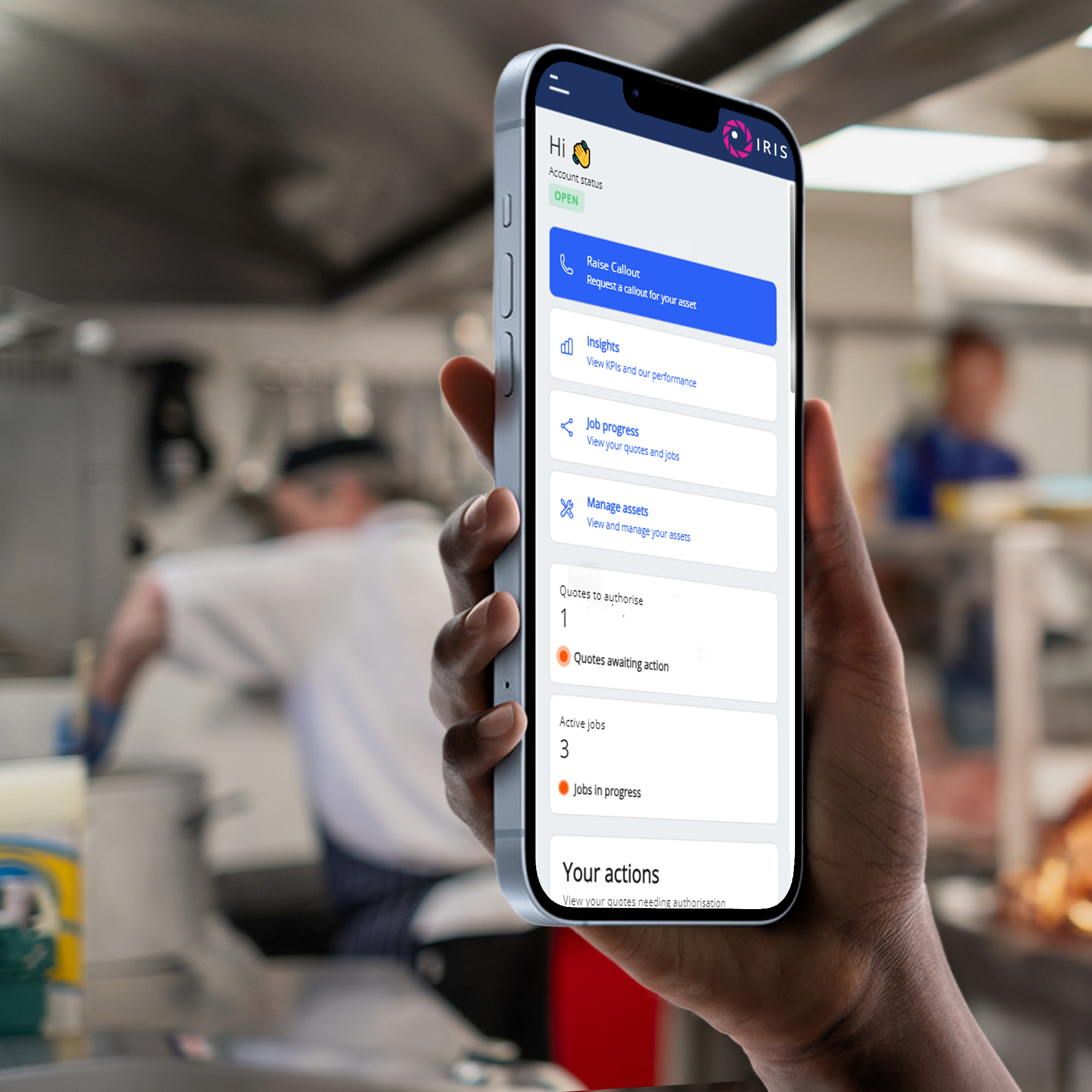 Close-up of a person holding a smartphone showing a financial management app interface with options like raising callout requests, viewing KPIs, managing assets, and checking job progress, set in an office environment.