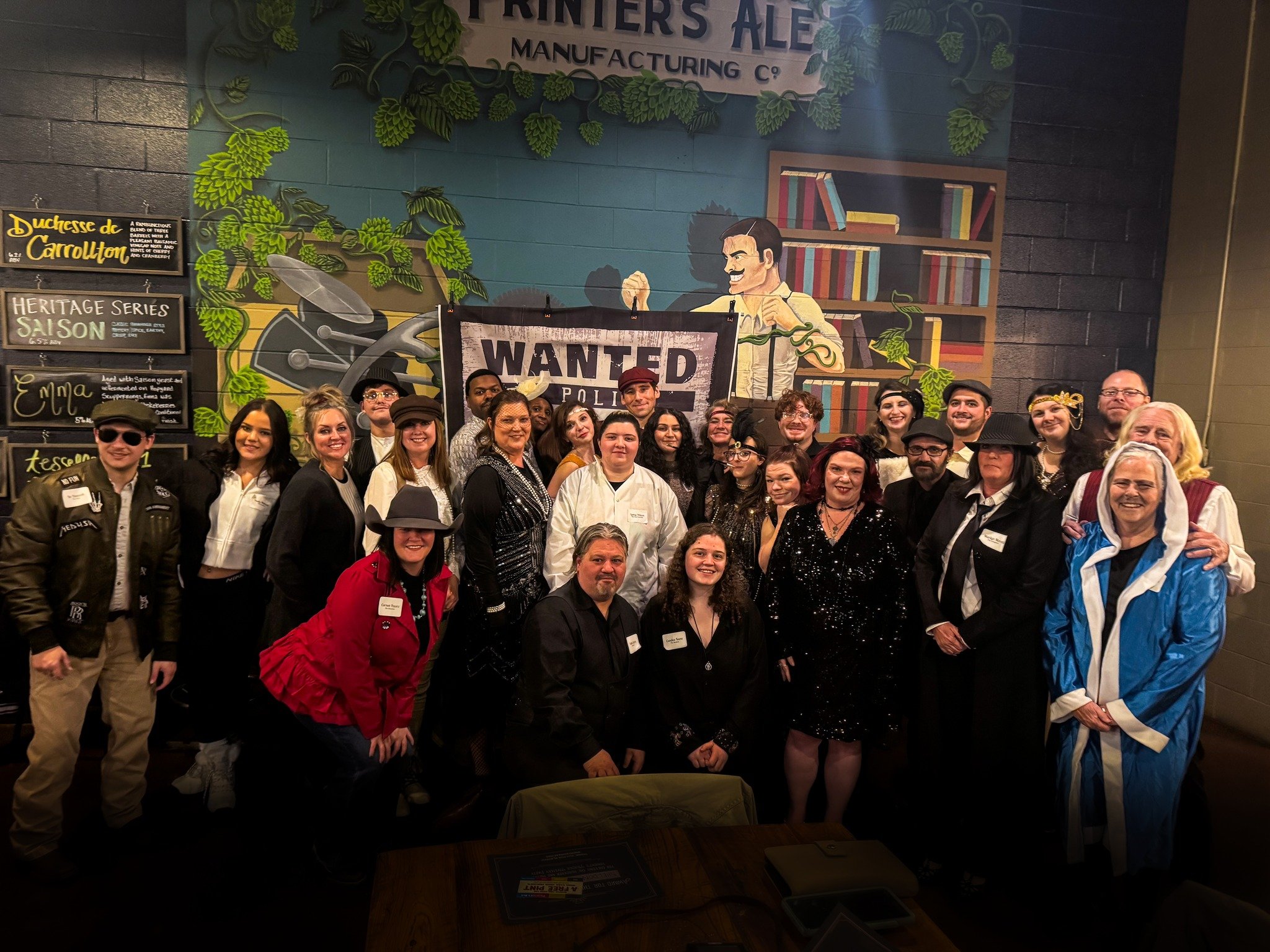 a group dressed up for a murder mystery party