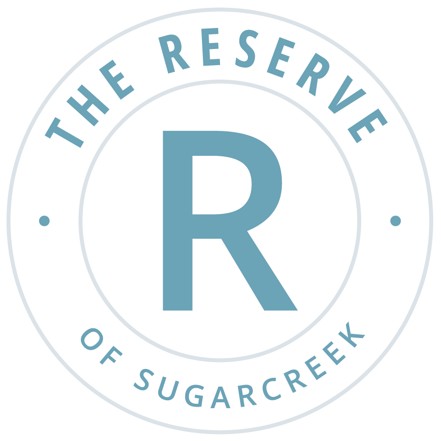 Logo for the Reserve of Sugarcreek featuring a large 'R' in the center with the words 'The Reserve of Sugarcreek' encircling it.