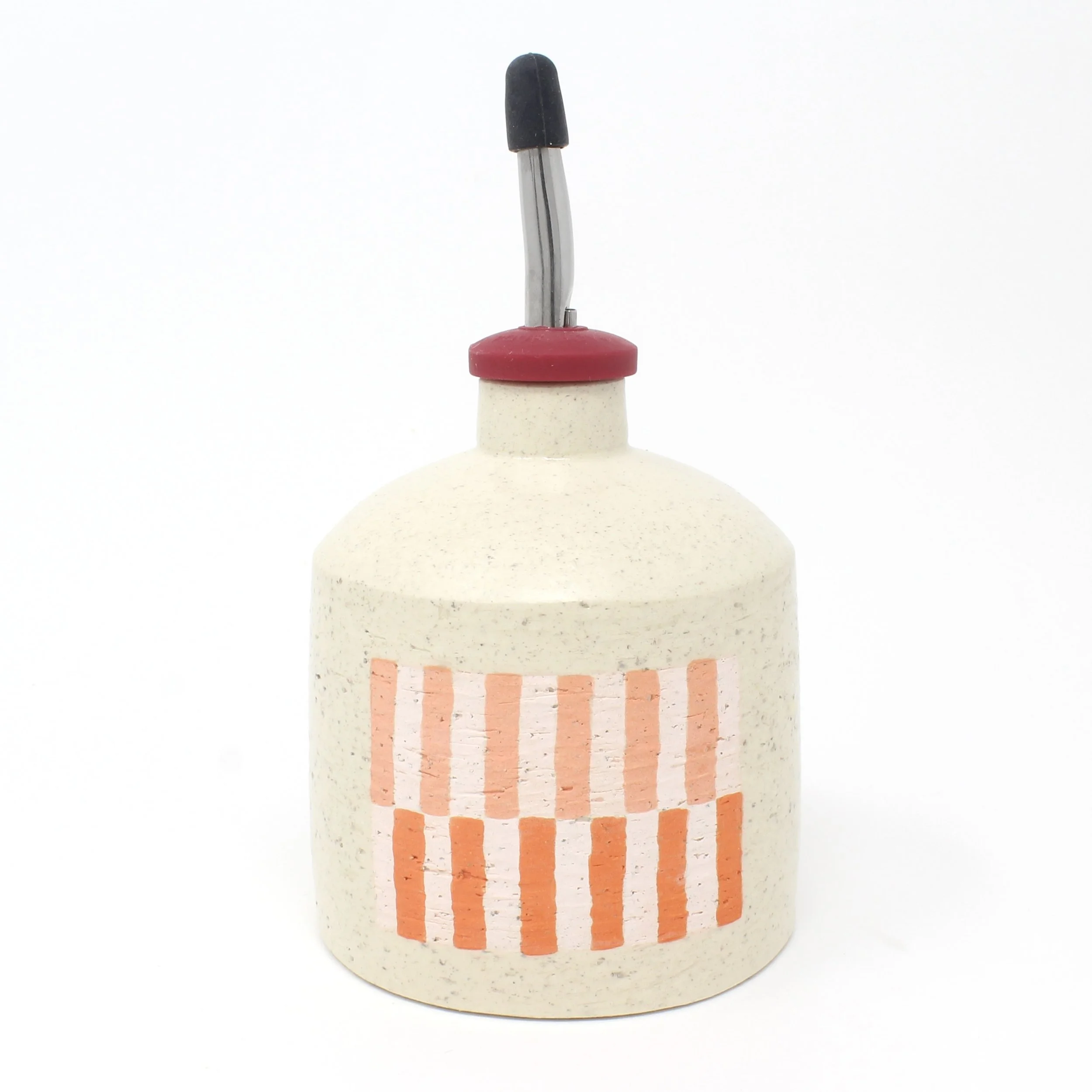 oil bottle with red and pink design