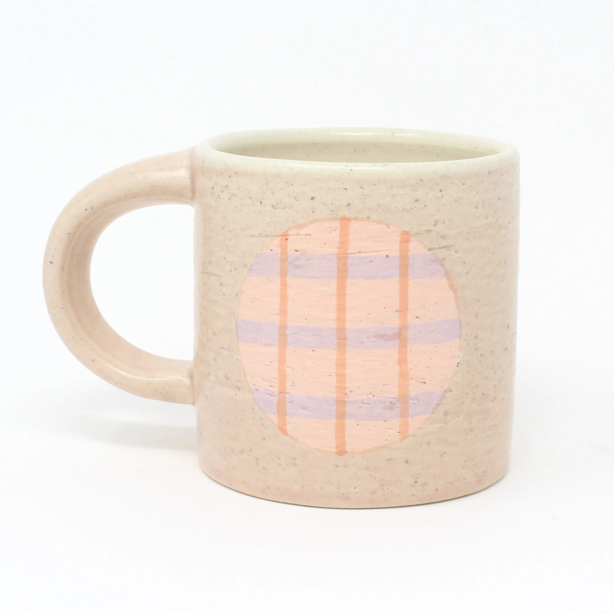 pink cup with pink and purple plaid design