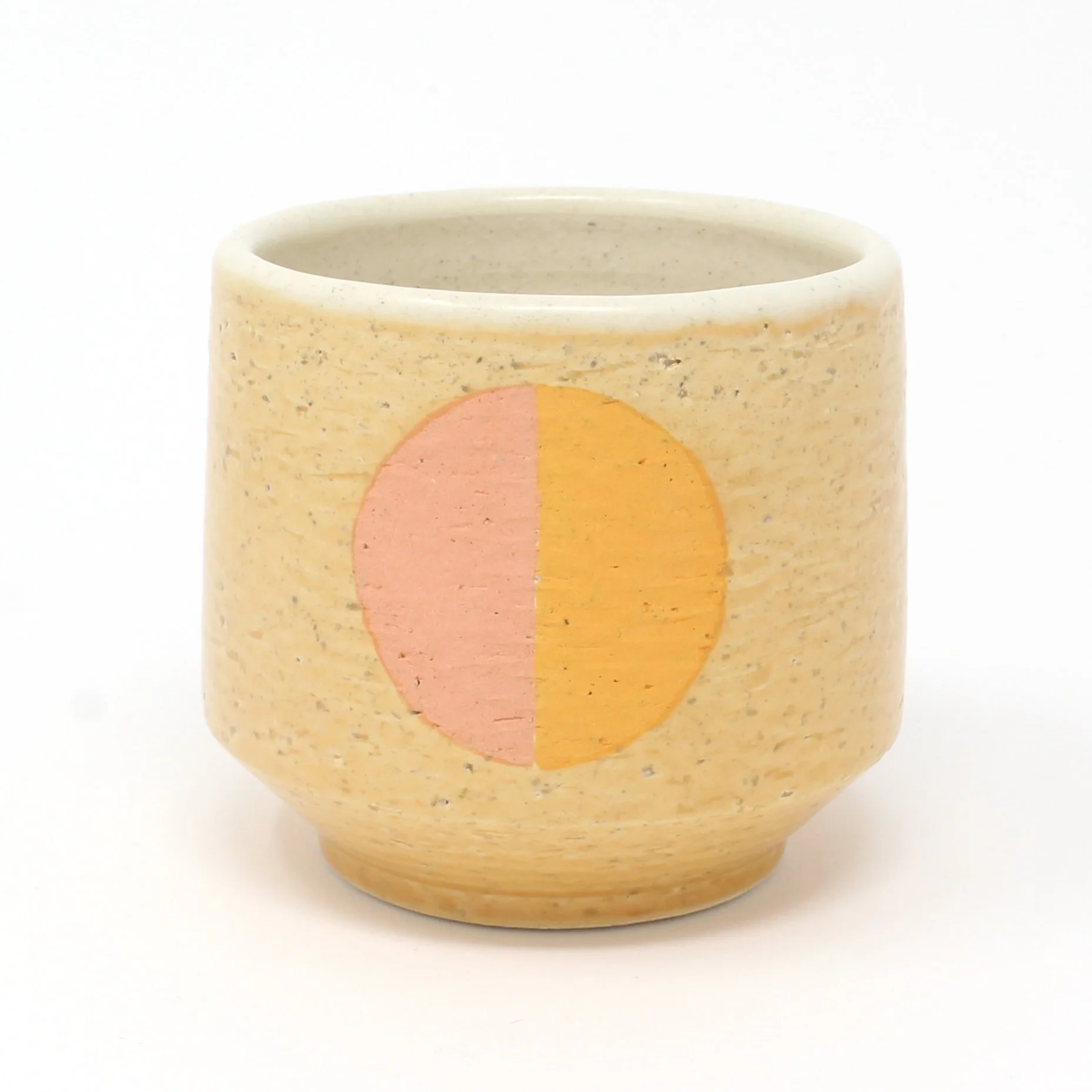 orange mug with pink and orange circle