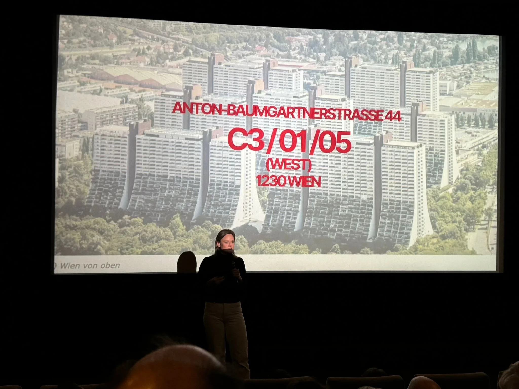 Director Bianca Gleissinger giving a lecture in St. Gallen Switzerland on Architecture and social housing after the screening of 27 Storeys.