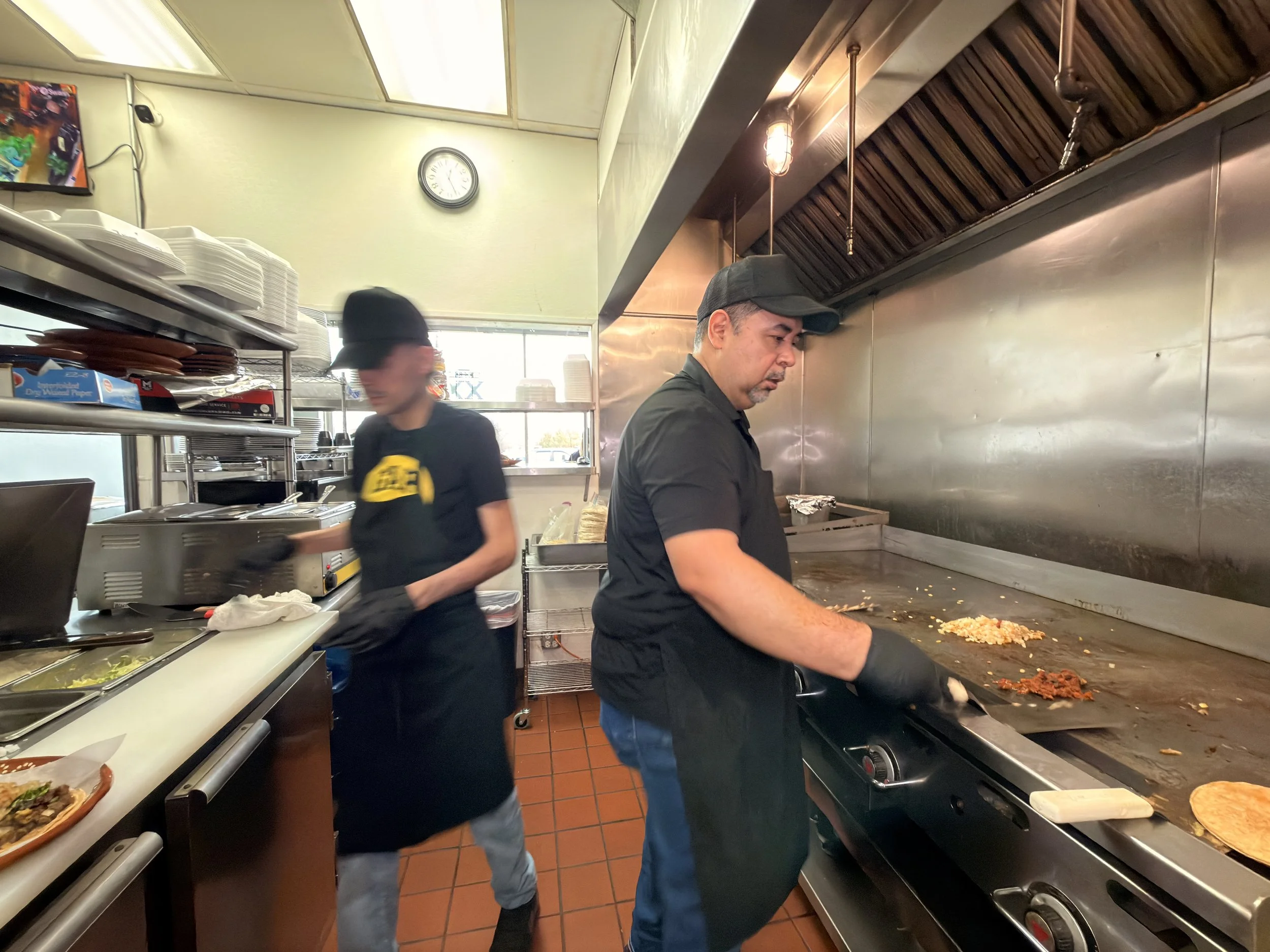 Chefs preparing Mexican food in restaurant kitchen Geneva IL