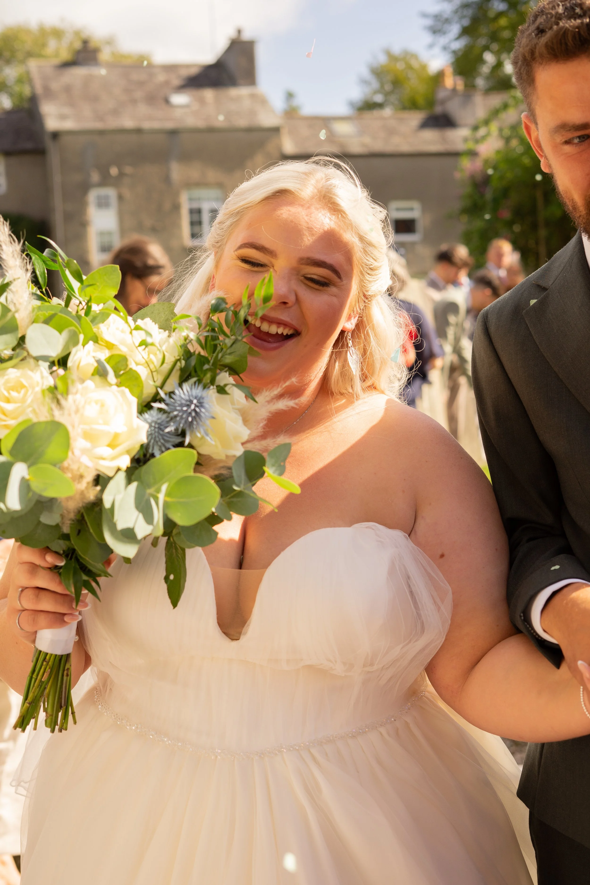 Bride Ducking From Confetti.jpg