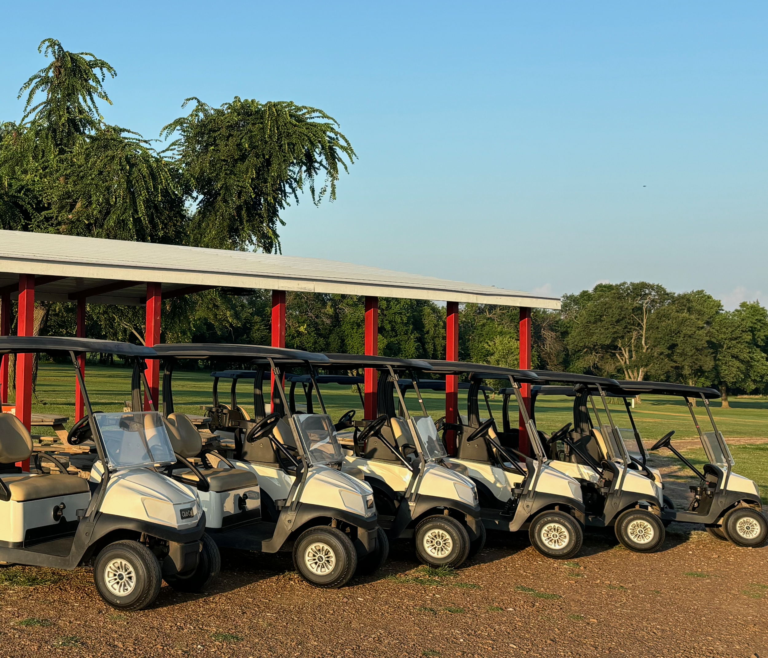 Oswego Golf Course Tournament and Event Calendar link. Picture of golf carts lined up and ready.