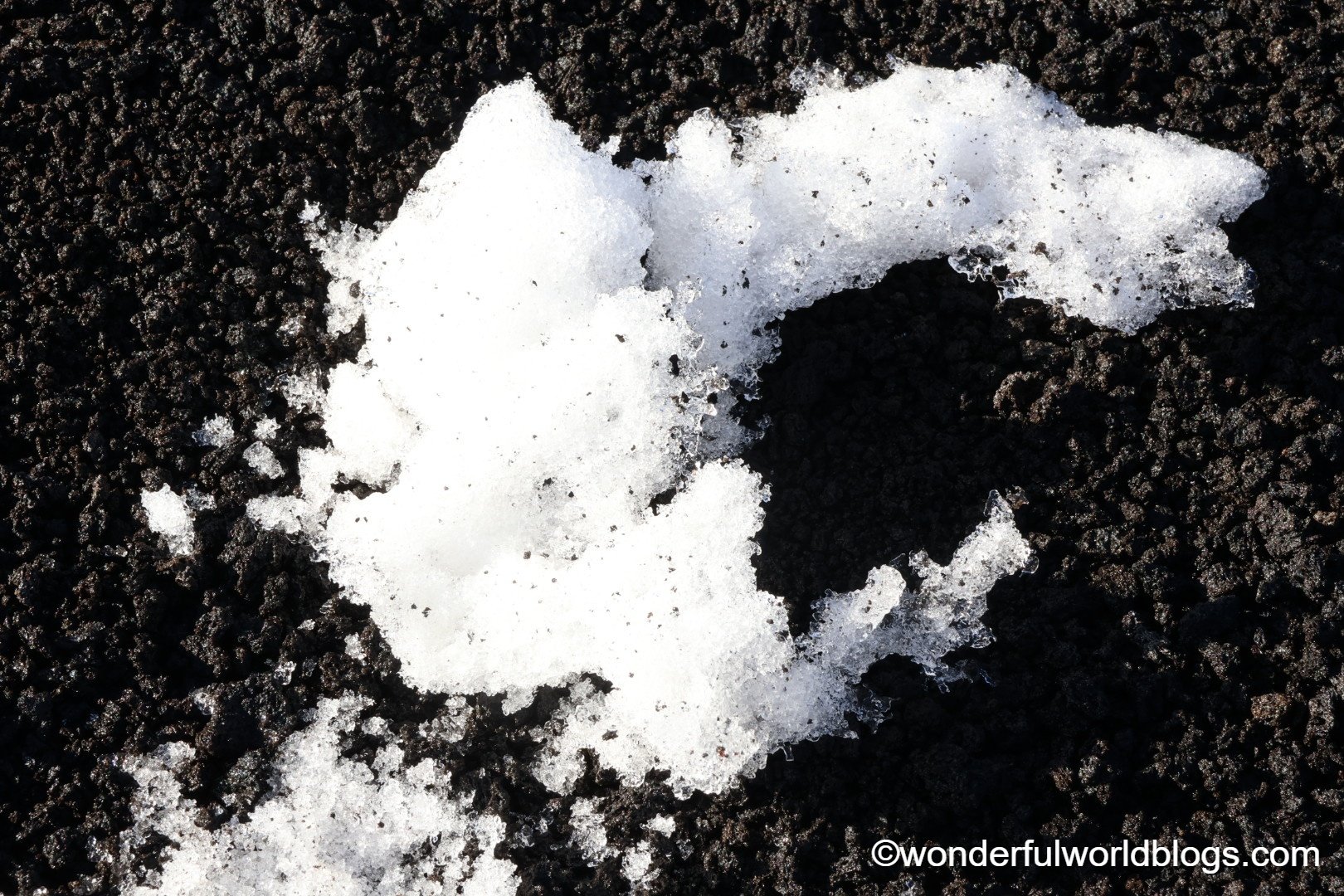 Snow on volcanic earth Mount Etna Sicily Italy