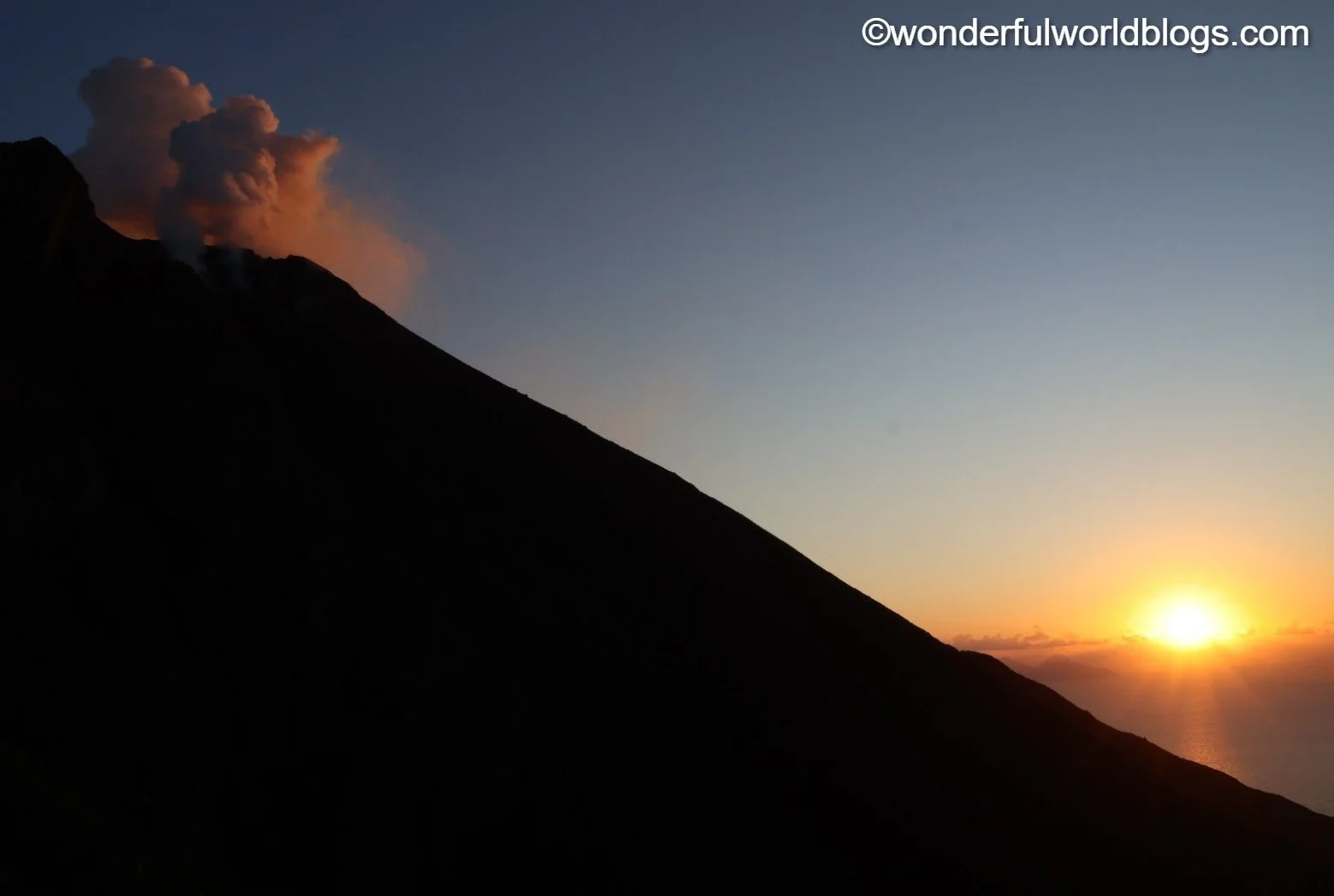 Stromboli volcano erupting at sunset Sicily Italy