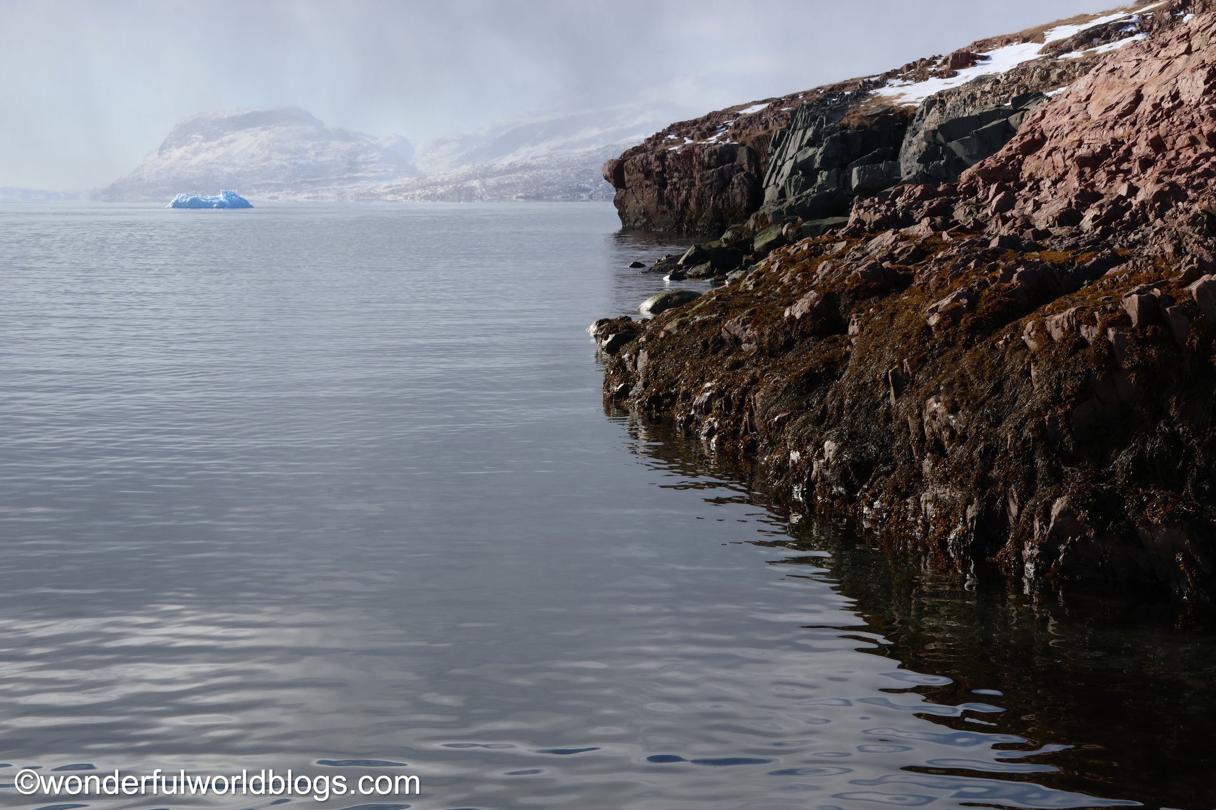 View along fjord with iceberg Greenland