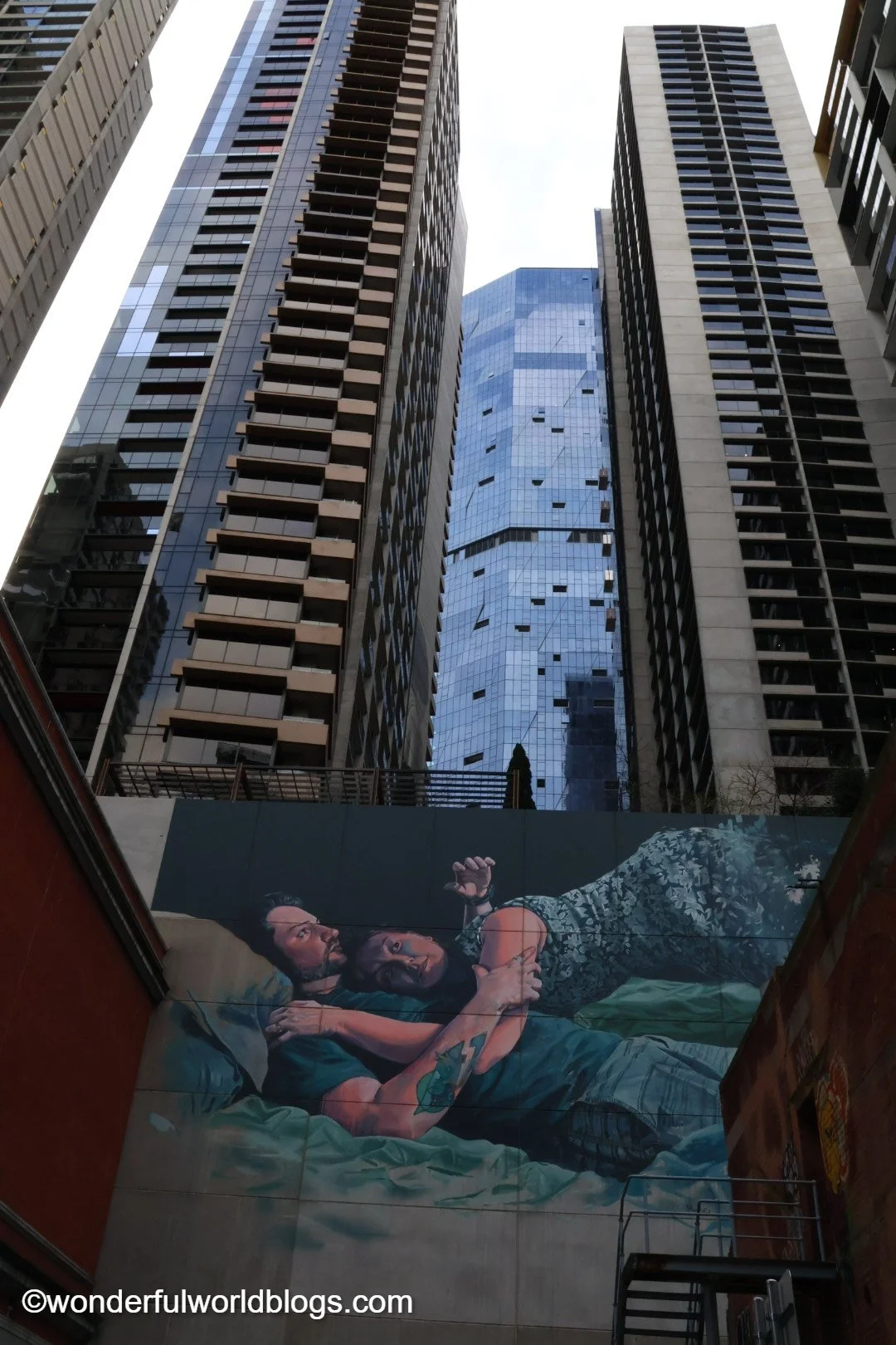 Graffiti of couple with skyscrapers in Melbourne Australia