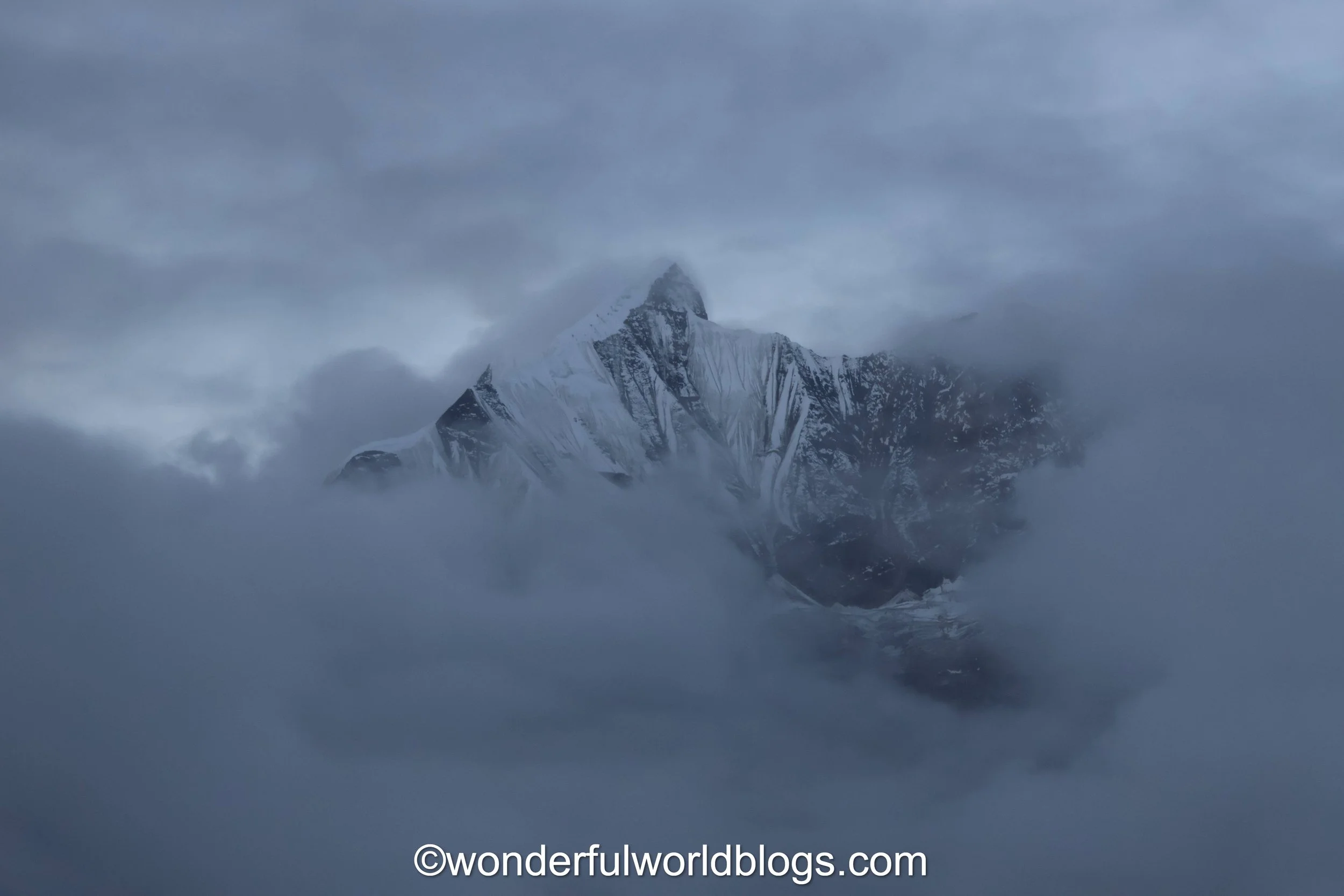 Mountains in clouds at Annapurna Base Camp Nepal