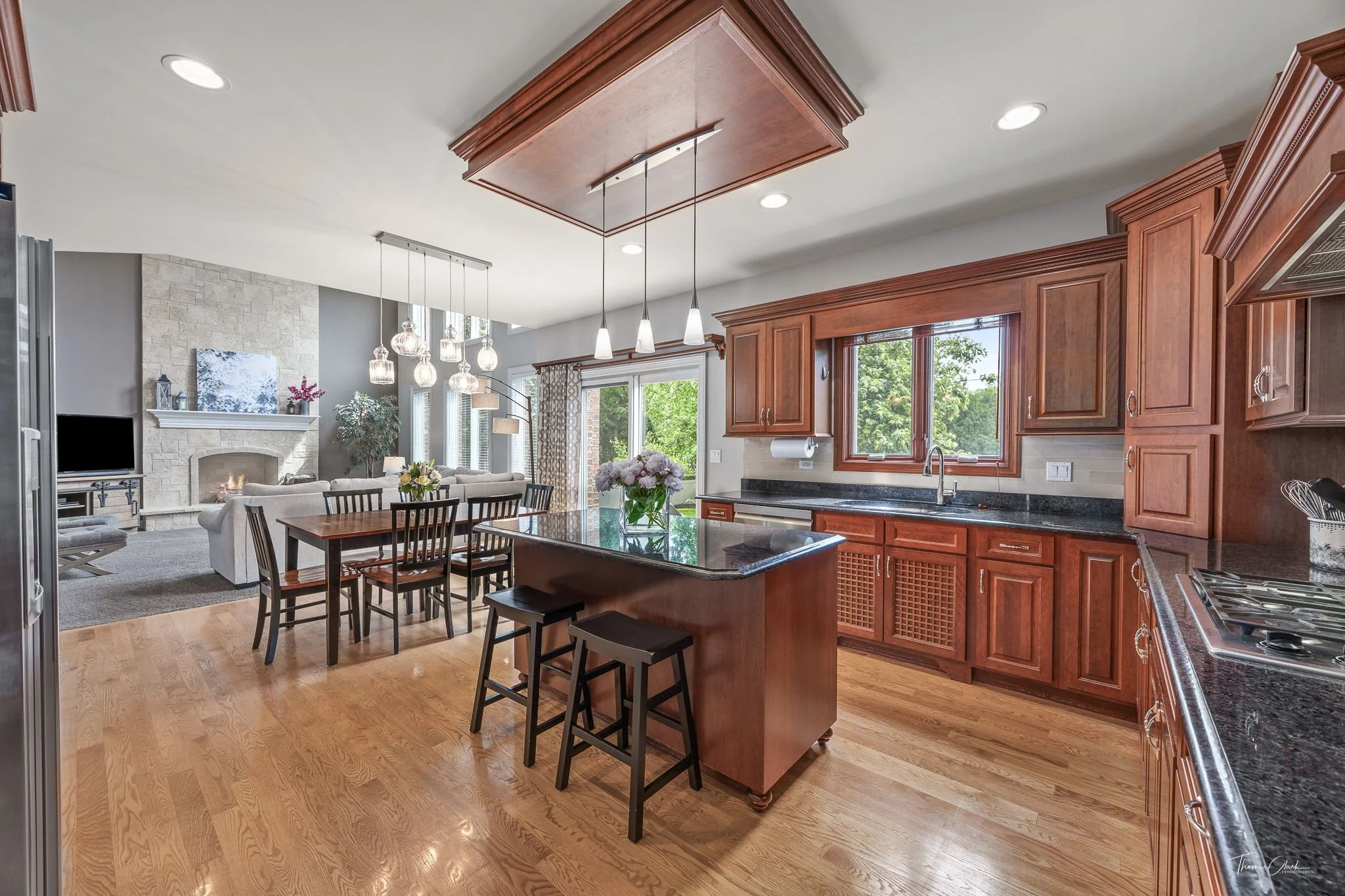 Clean kitchen with dark wooden cabinets and modern appliances