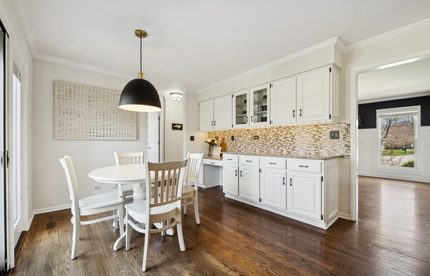 Detail of a high-end staged kitchen showing the island and backsplash.