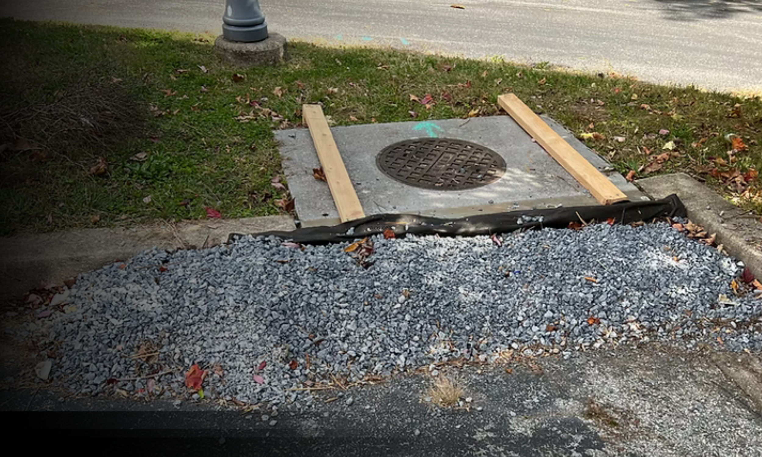 Curb inlet protection installed to filter sediment and debris before stormwater enters a storm drain