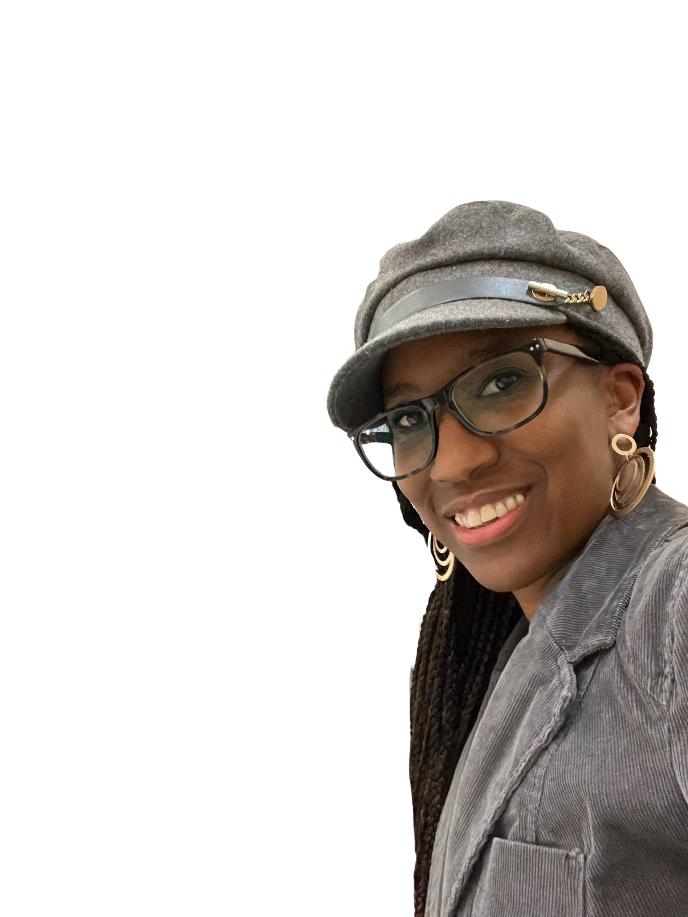 Smiling woman wearing glasses and a gray hat with a decorative pin, gold earrings, and a gray jacket.