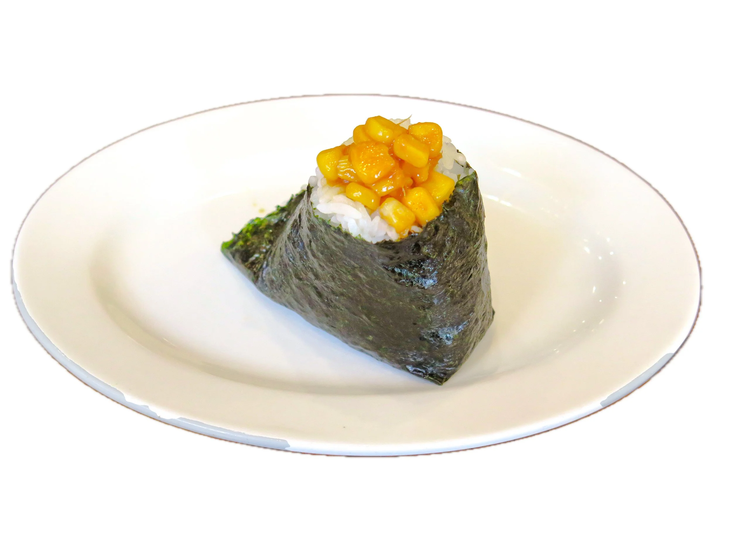 A single piece of sushi with rice, wrapped in nori seaweed, topped with yellow corn kernels, on a white oval plate.