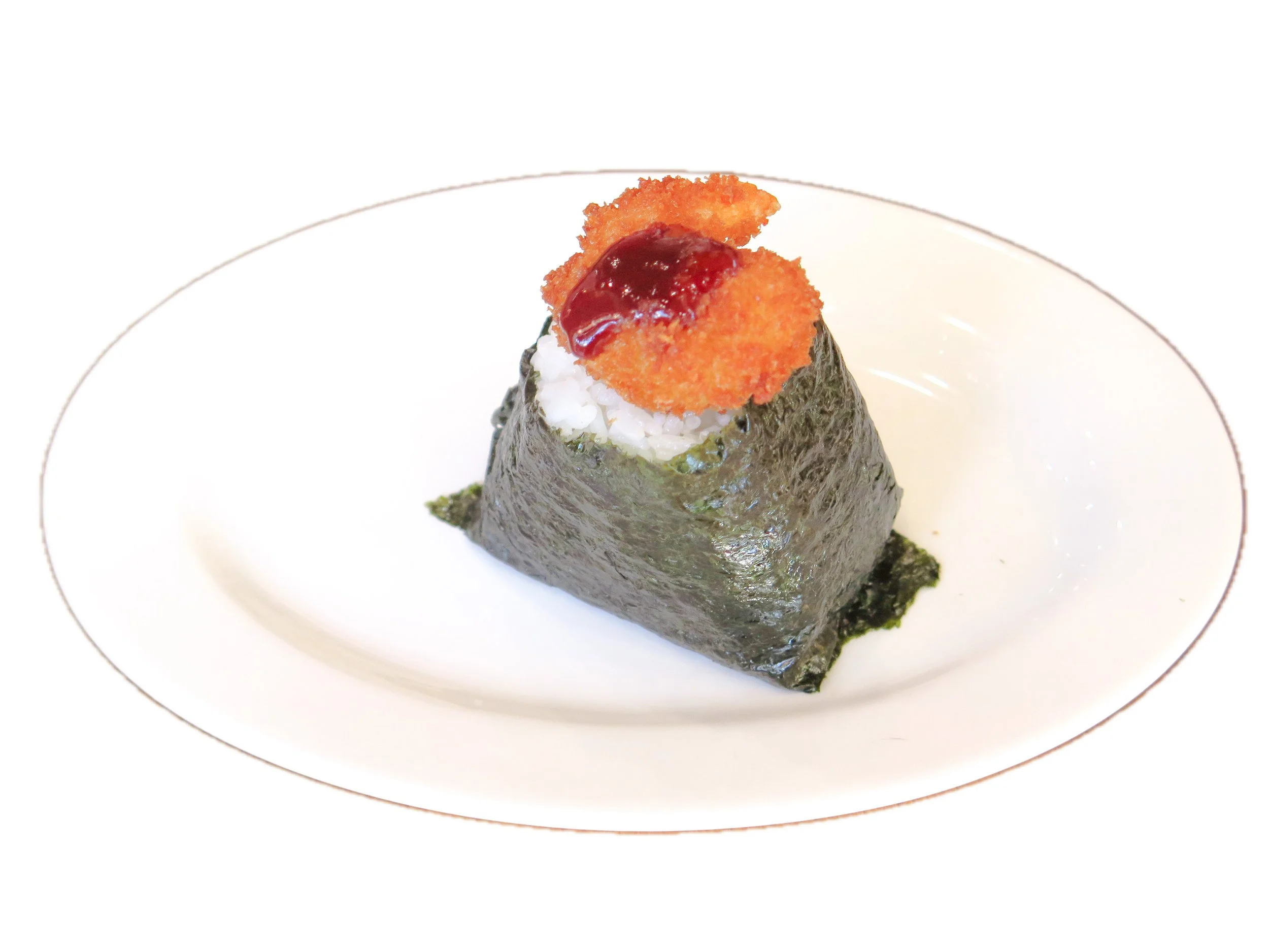 A piece of sushi wrapped in seaweed with rice, topped with fried shrimp and a drizzle of sauce on top, served on a white plate.