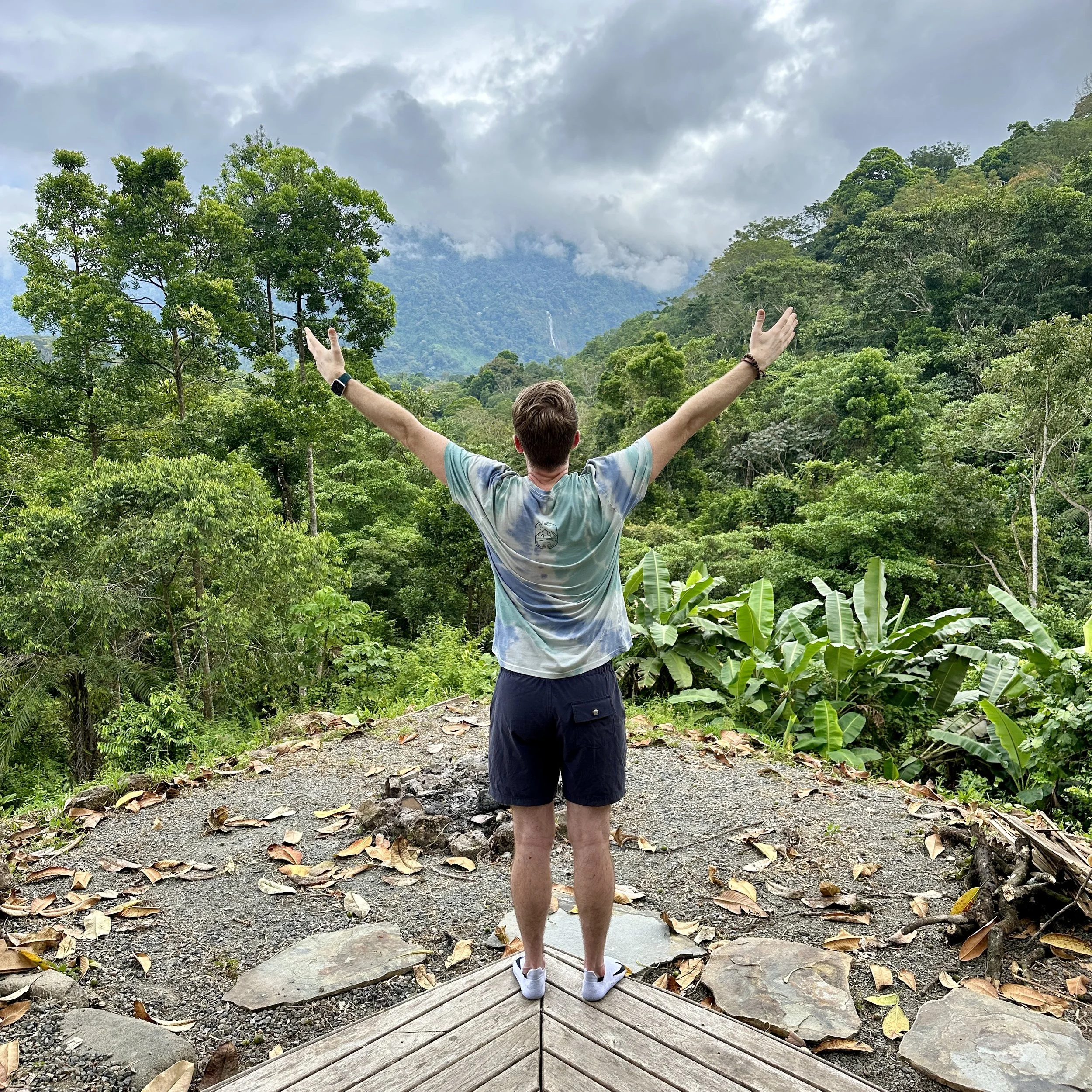 Chase Cain standing on the edge of a forest in Costa Rica.