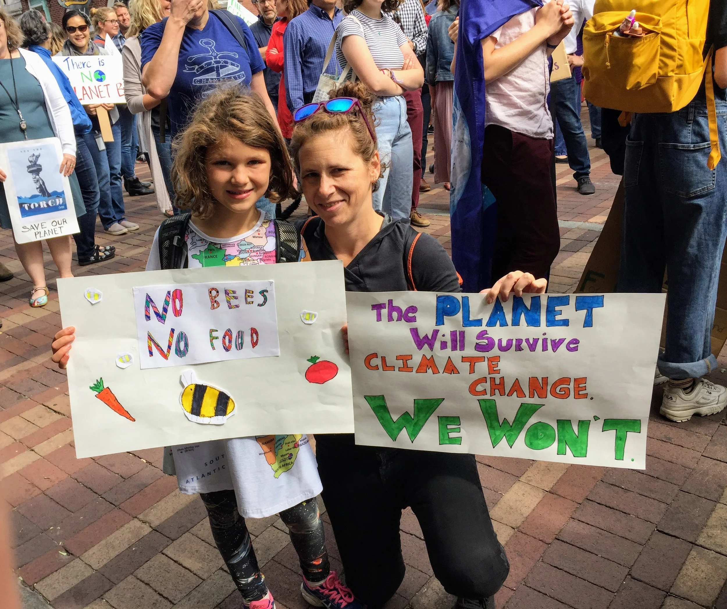 Joanna and her child, Isa, protesting inaction on climate change. 