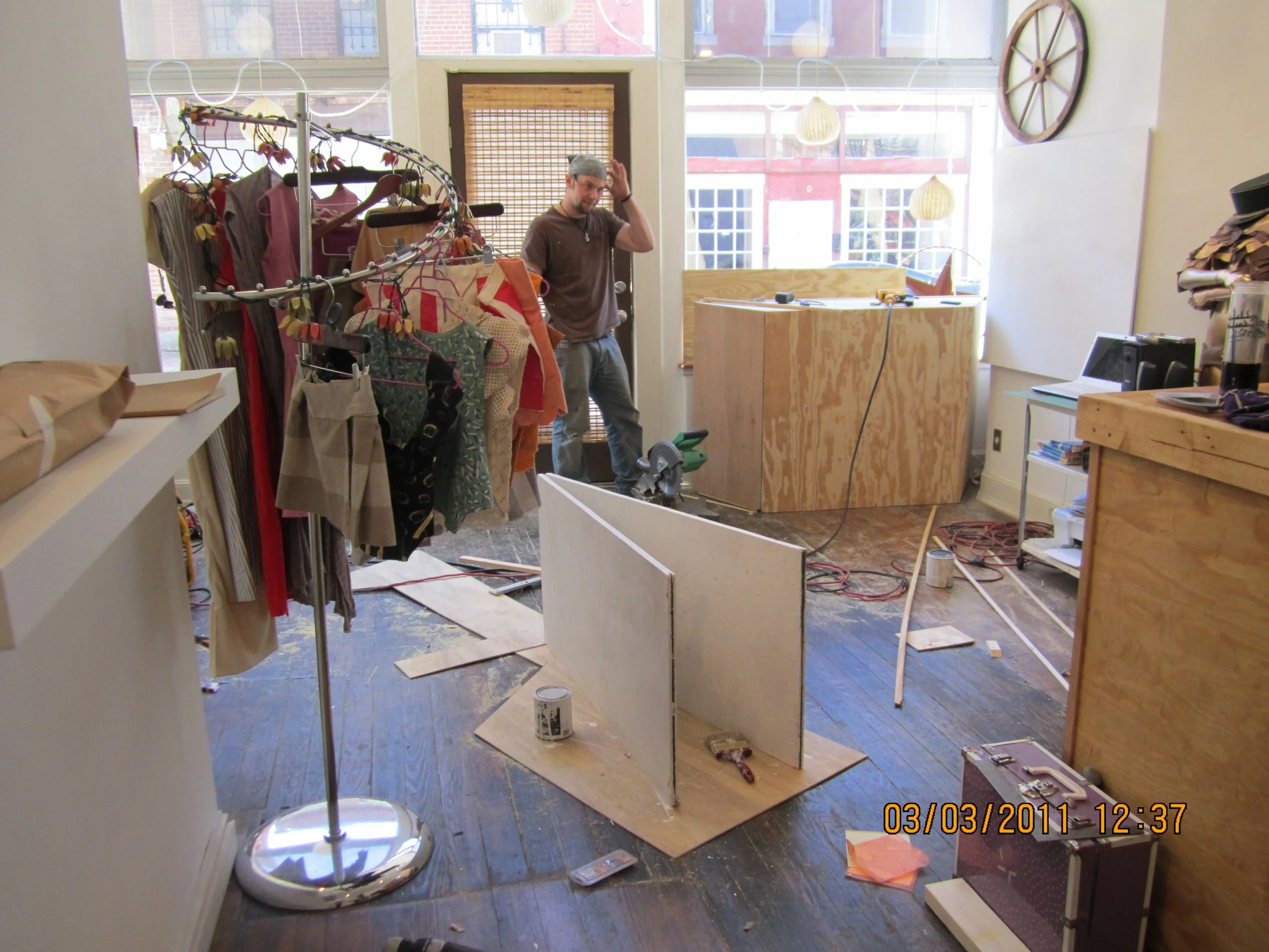 Setting up shop. Jason Fletcher working on build outs the day before opening ; )