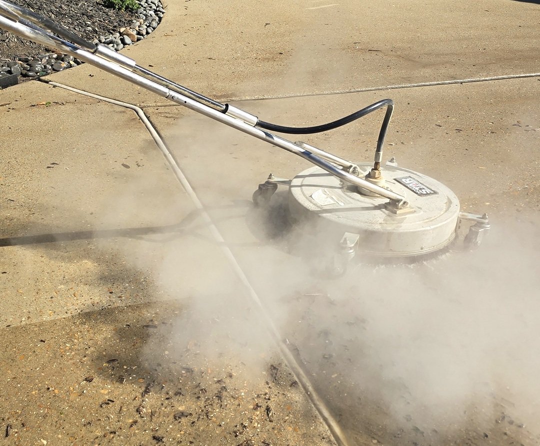 Surface cleaner restoring concrete driveway in Montgomery County TX