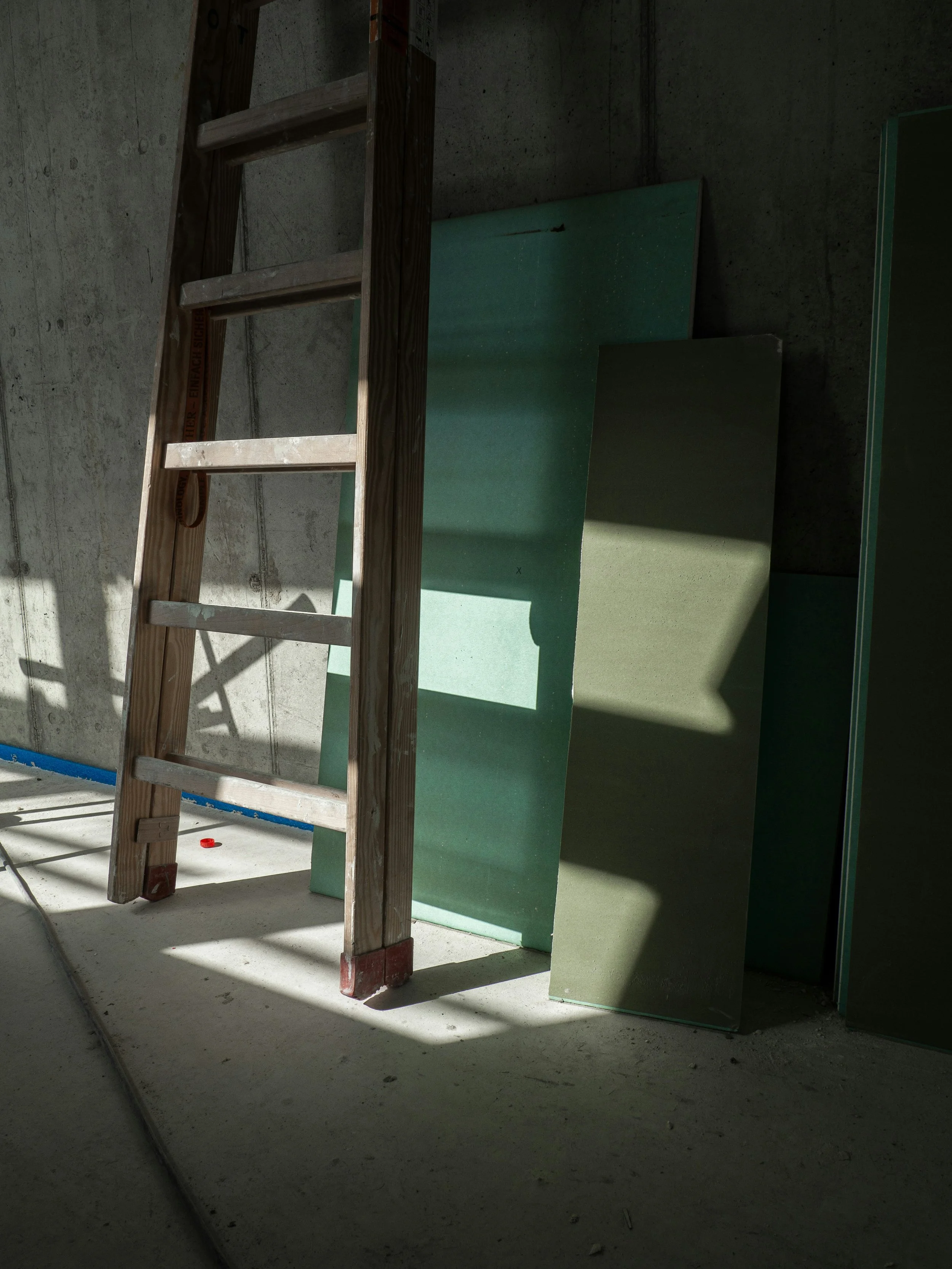 Ladder + drywall construction site in progress