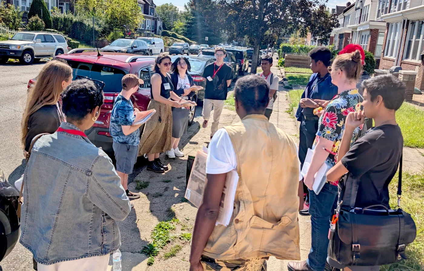 Eleven ESWA volunteers on the street briefing a membership canvass on a bright sunny day.