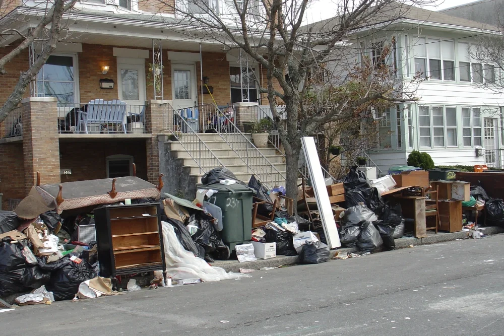 Atlantic City street with mounds of household objects at the curb destroyed by flooding after Super Storm Sandy