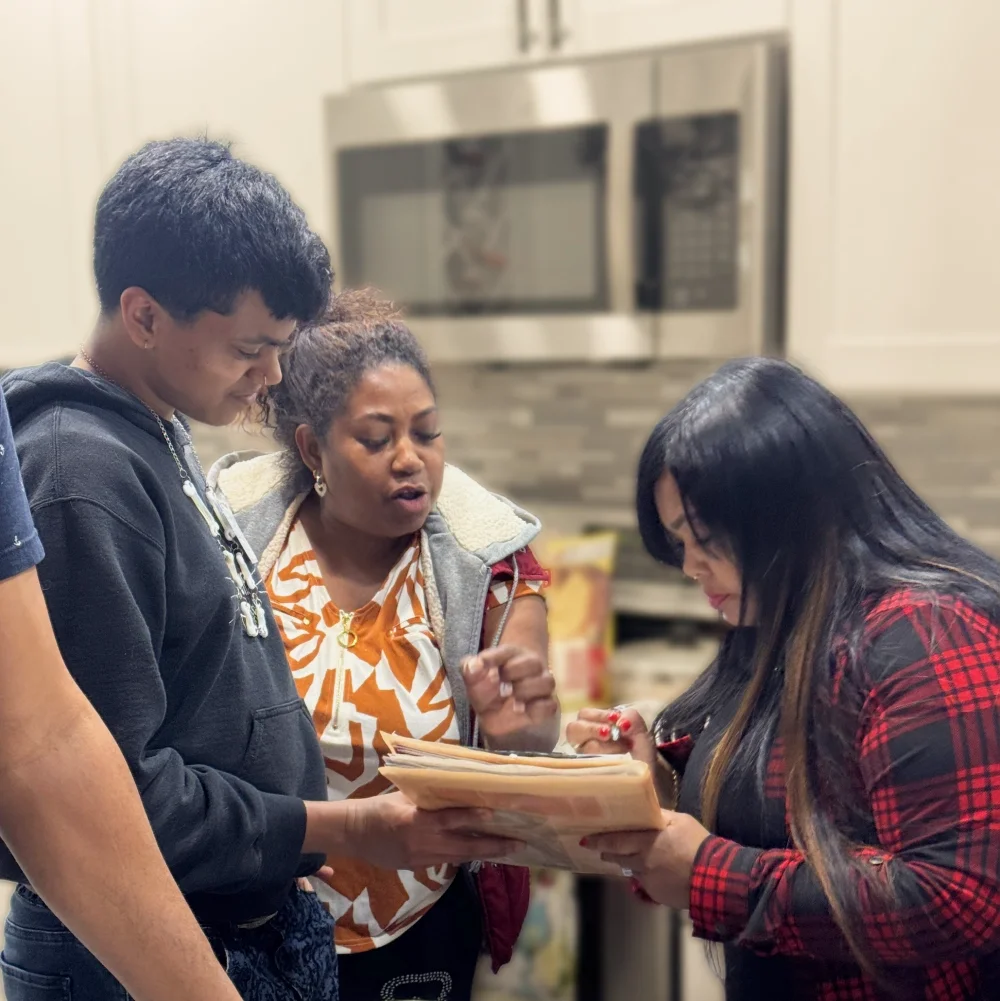 A delegate briefs a member on how to do a benefit intake. Delegates represent groups of members in their local area or their occupation.