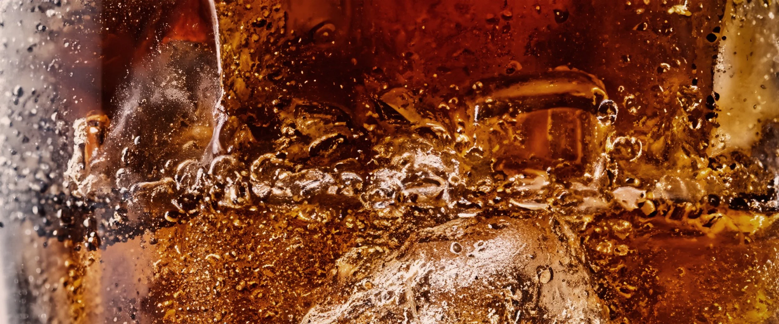 vecteezy_cola-soda-and-ice-splashing-fizzing-or-floating-up-to-top-of_44318564.jpg
