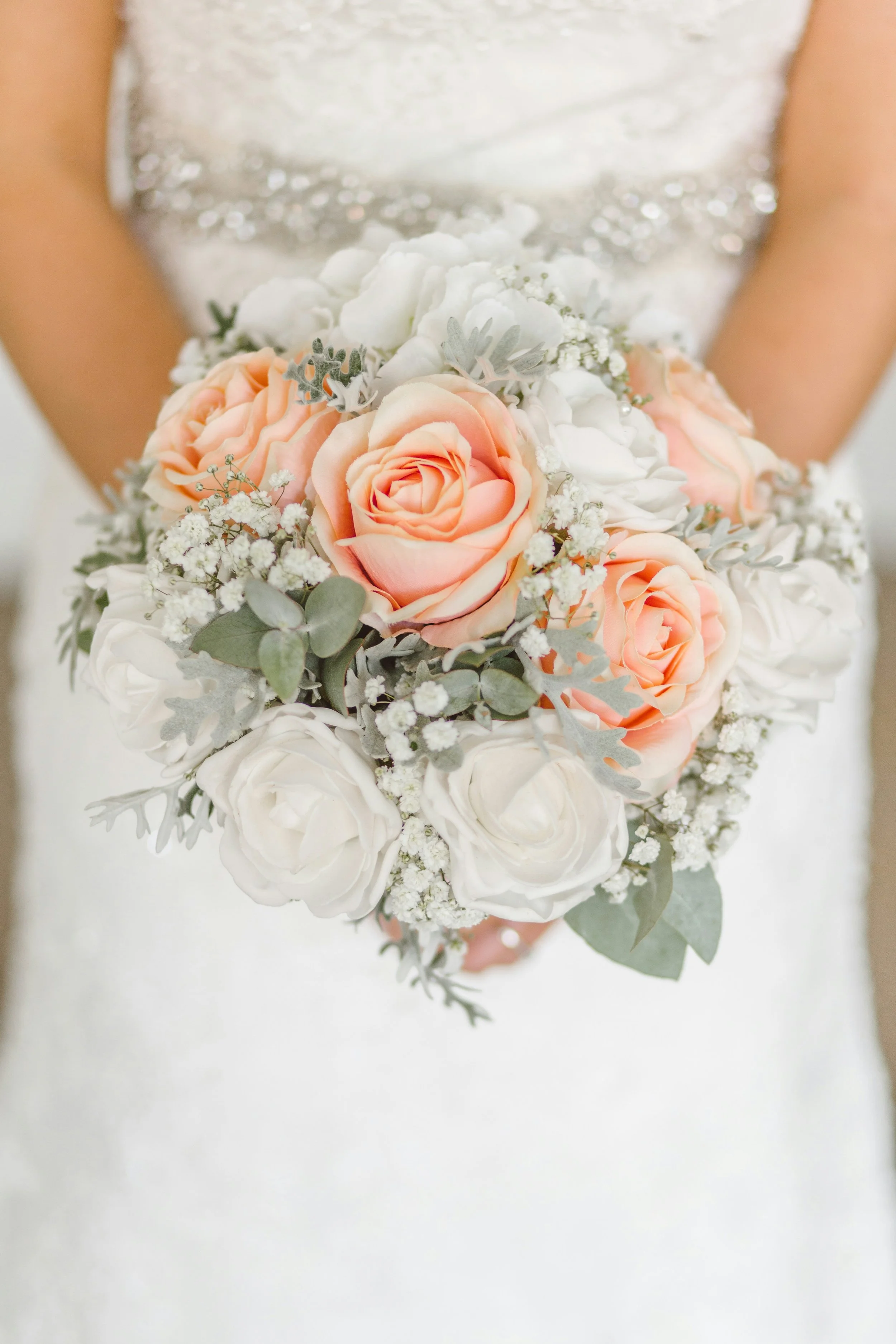 bride with orange roses