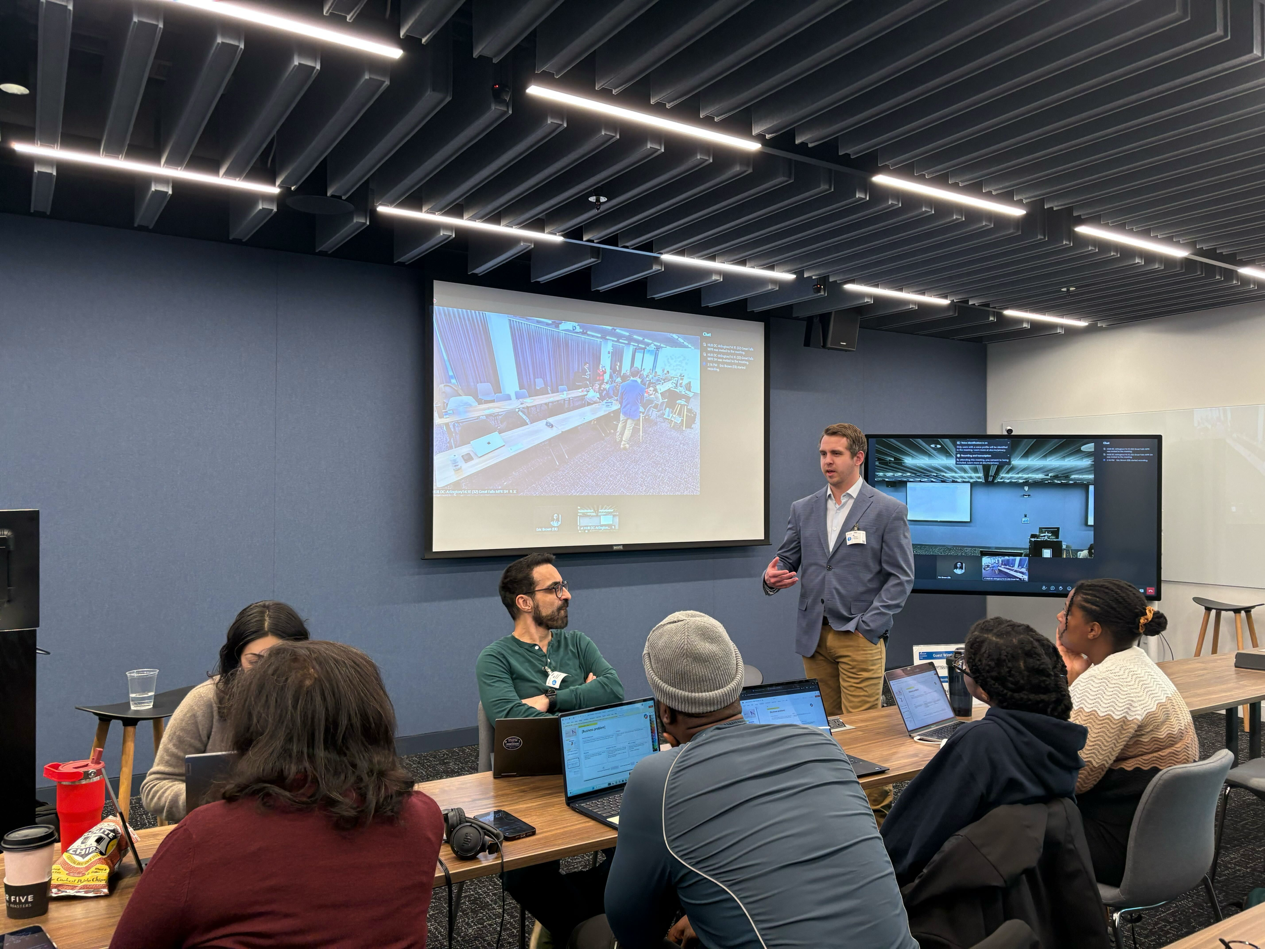 Upskilling Labs participants discussing ideas with one of the tech mentor.