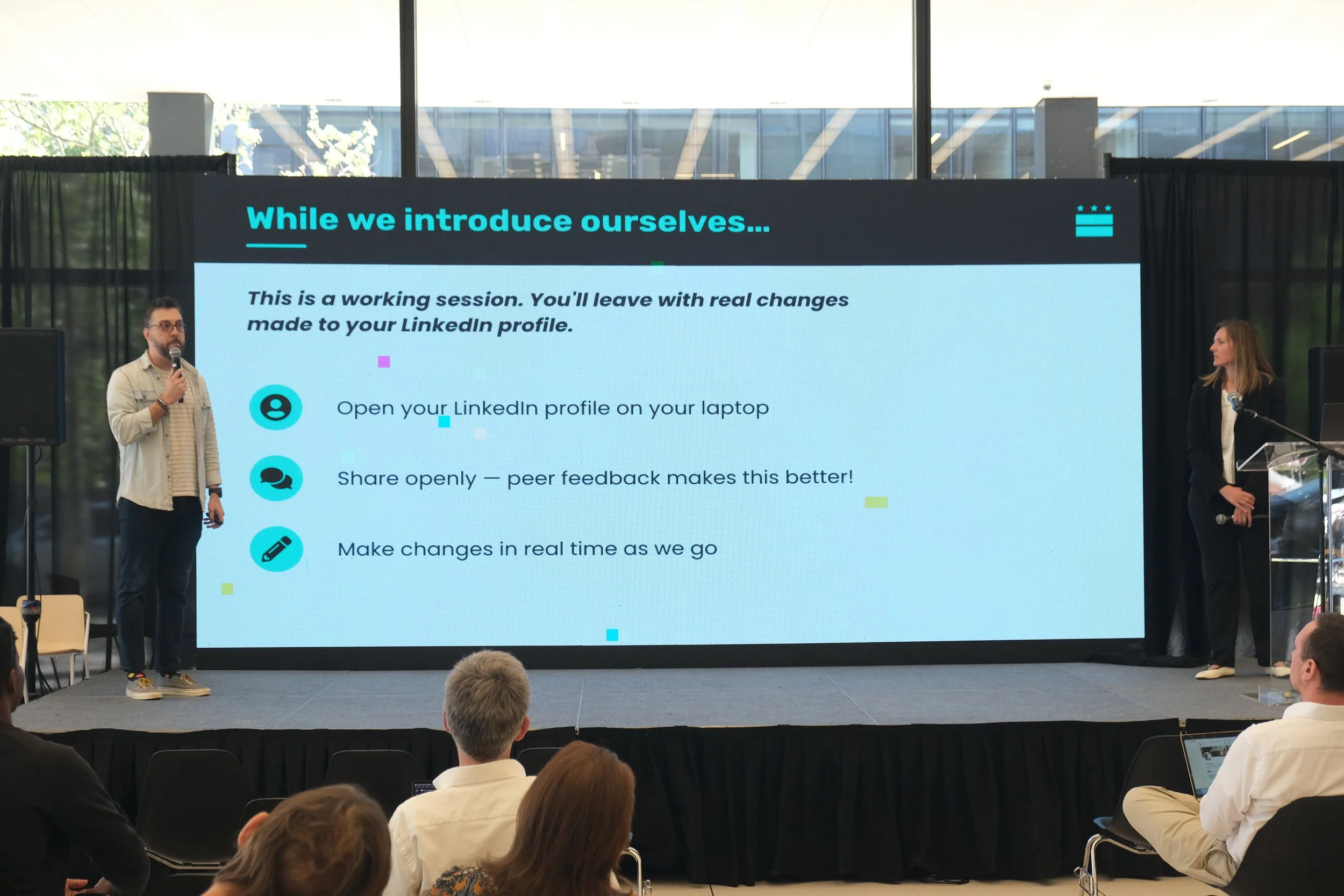 Javi Calderon and Lea Berry showing the audience how to optimize your LinkedIn profile.
