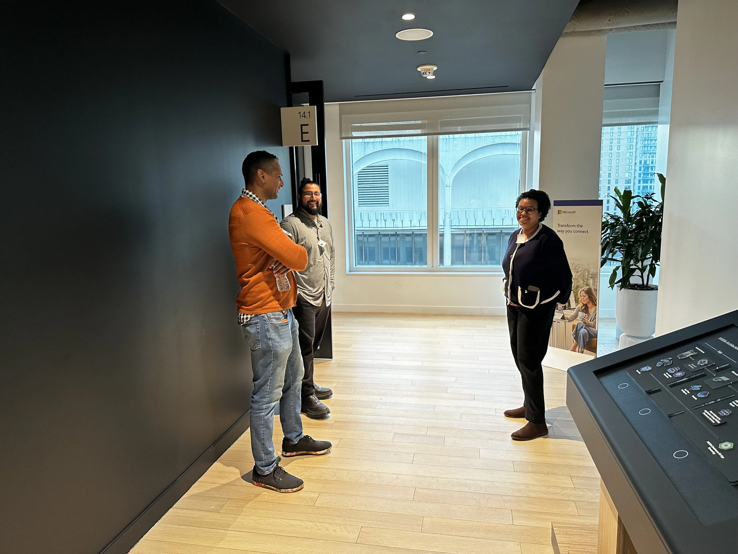 The Upskilling Labs mentors talking with Afnan Adams, who helped organize the event.