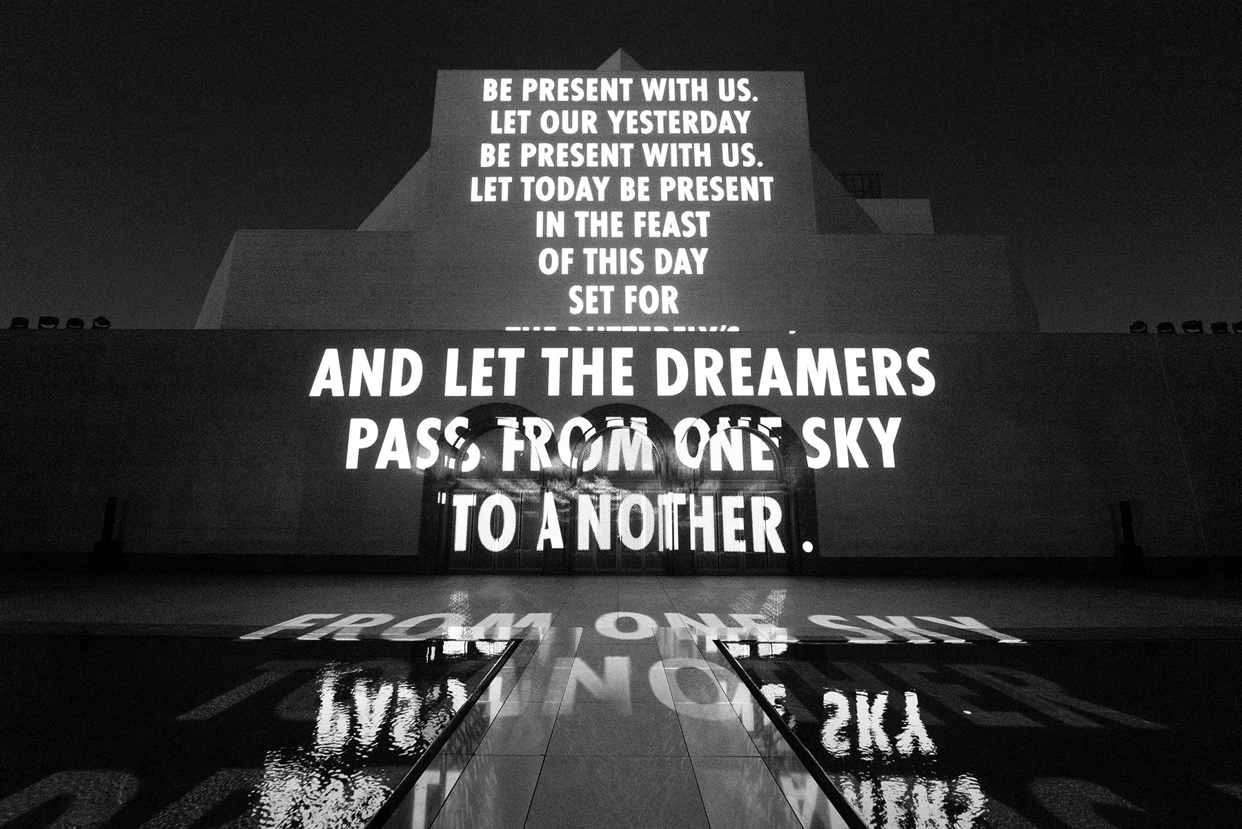 SONG, 2026

Light projection

Islamic Museum of Art, Doha

Text: “The Dreamers Pass from One Sky to Another” by Mahmoud Darwish, © 2026 by the Mahmoud Darwish Foundation. Used with permission of the Mahmoud Darwish Foundation.

© 2026 Jenny Holzer, m
