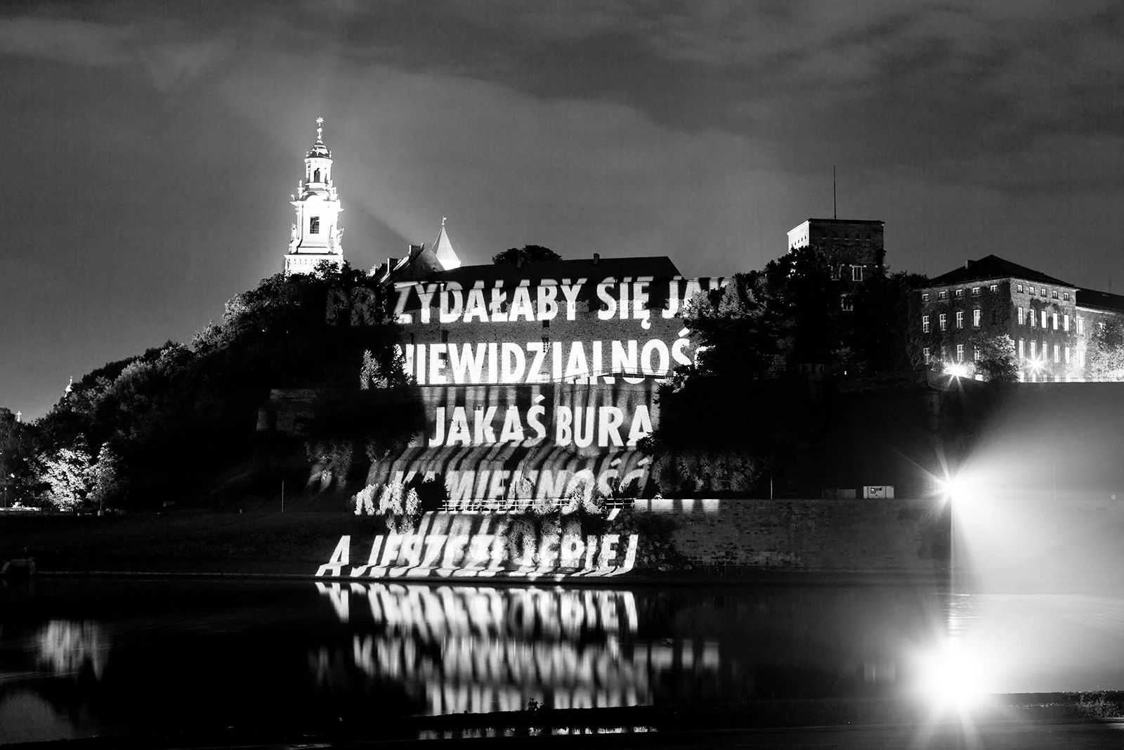 Site: Wawel Royal Castle, Krakow, Poland
June 10–24, 2011
Text: “Jacyś ludzie” by Wisława Szymborska. Used/reprinted with permission of the author.
Projection: FX Productions; Charles Passarelli
Photo: Tomasz Wiech