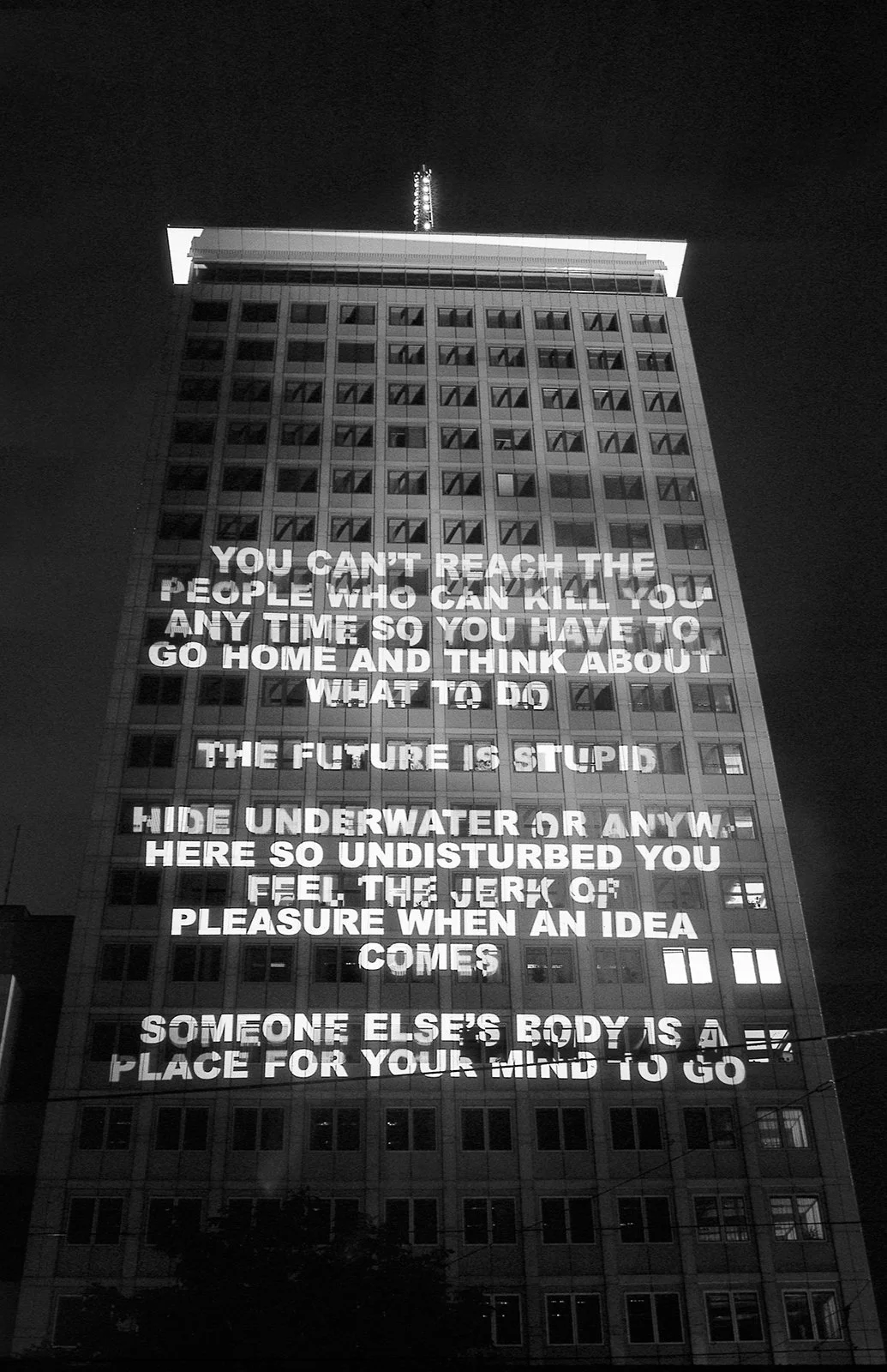 Site: Ringturm, Vienna, Austria
October 11, 1998
Text: Survival, 1983–85
Projection: Skypictures; Aubert Lee
Photo: Christian Wachter