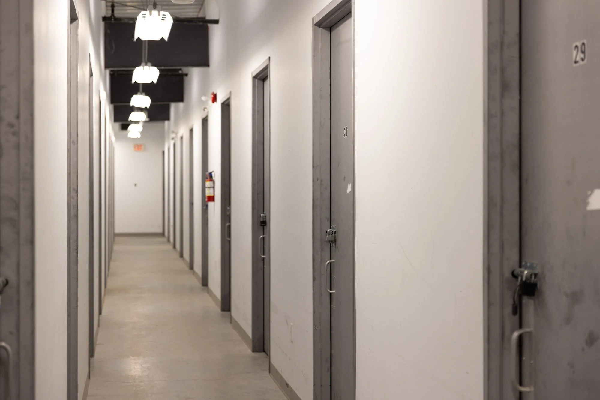 A hallway of secure, indoor, heated storage units in Available Storage facility located in the South End of Sudbury Ontario.