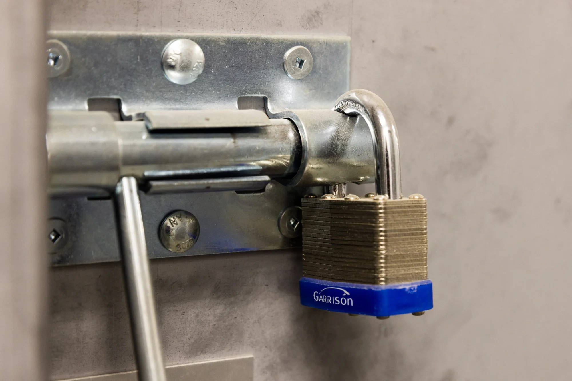 Close up of a lock locking a secure, indoor, heated storage unit in Available Storage facility located in the South End of Sudbury Ontario.