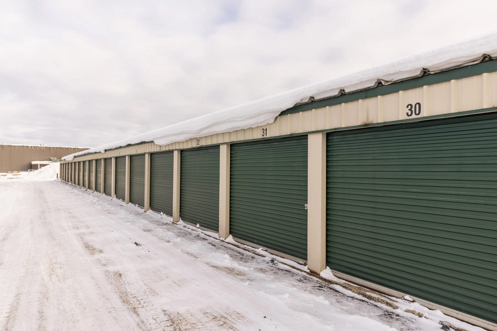 Row of outdoor unheated storage units that are within a secure gated property at Available Storage in the South End of Sudbury with affordable pricing