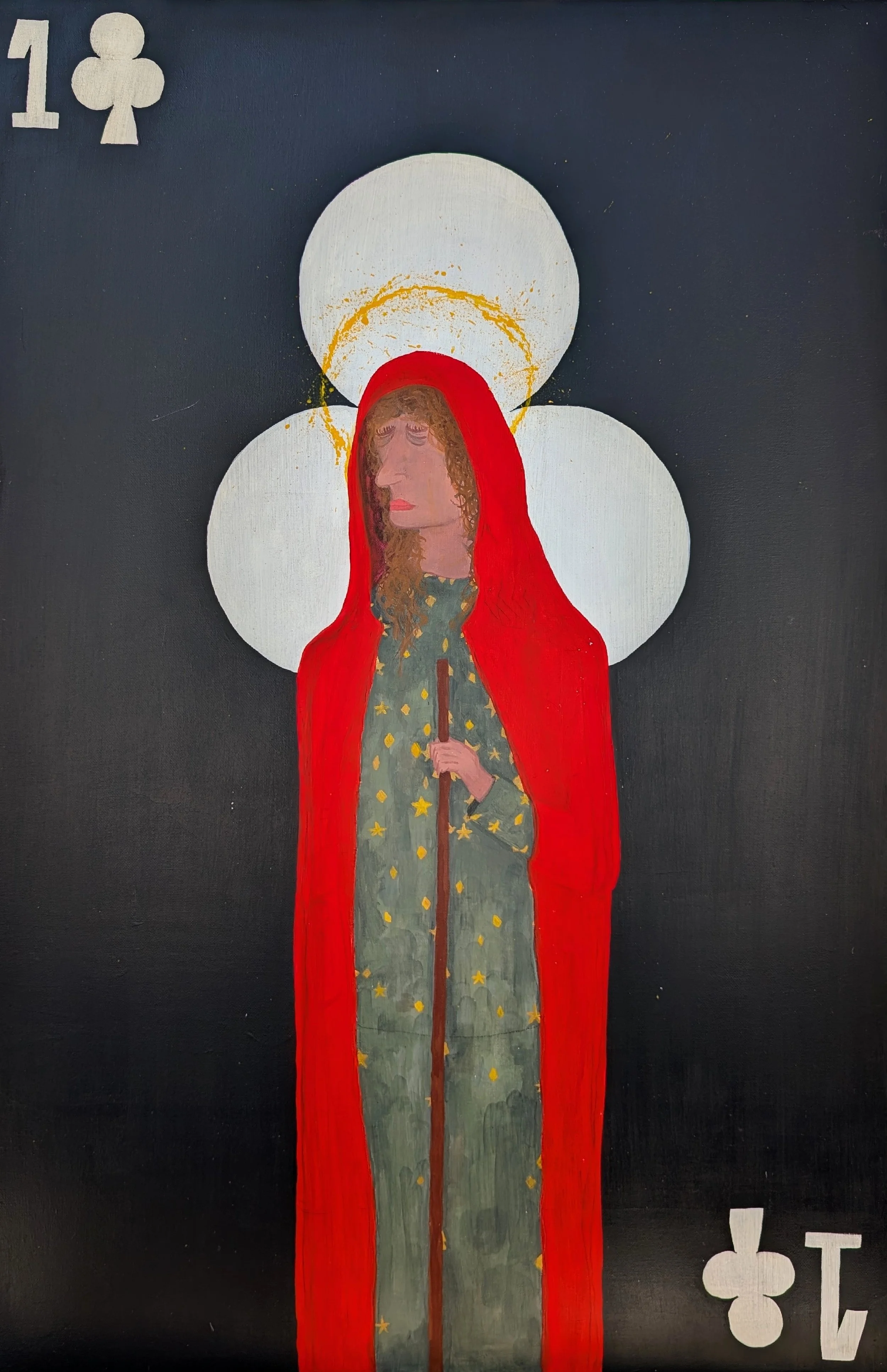 A painting of a woman with curly hair, wearing a green dress decorated with yellow stars, and a red cloak with a hood. She is holding a staff, with a halo behind her head and a large white circle behind her head. There are playing card suits of clubs