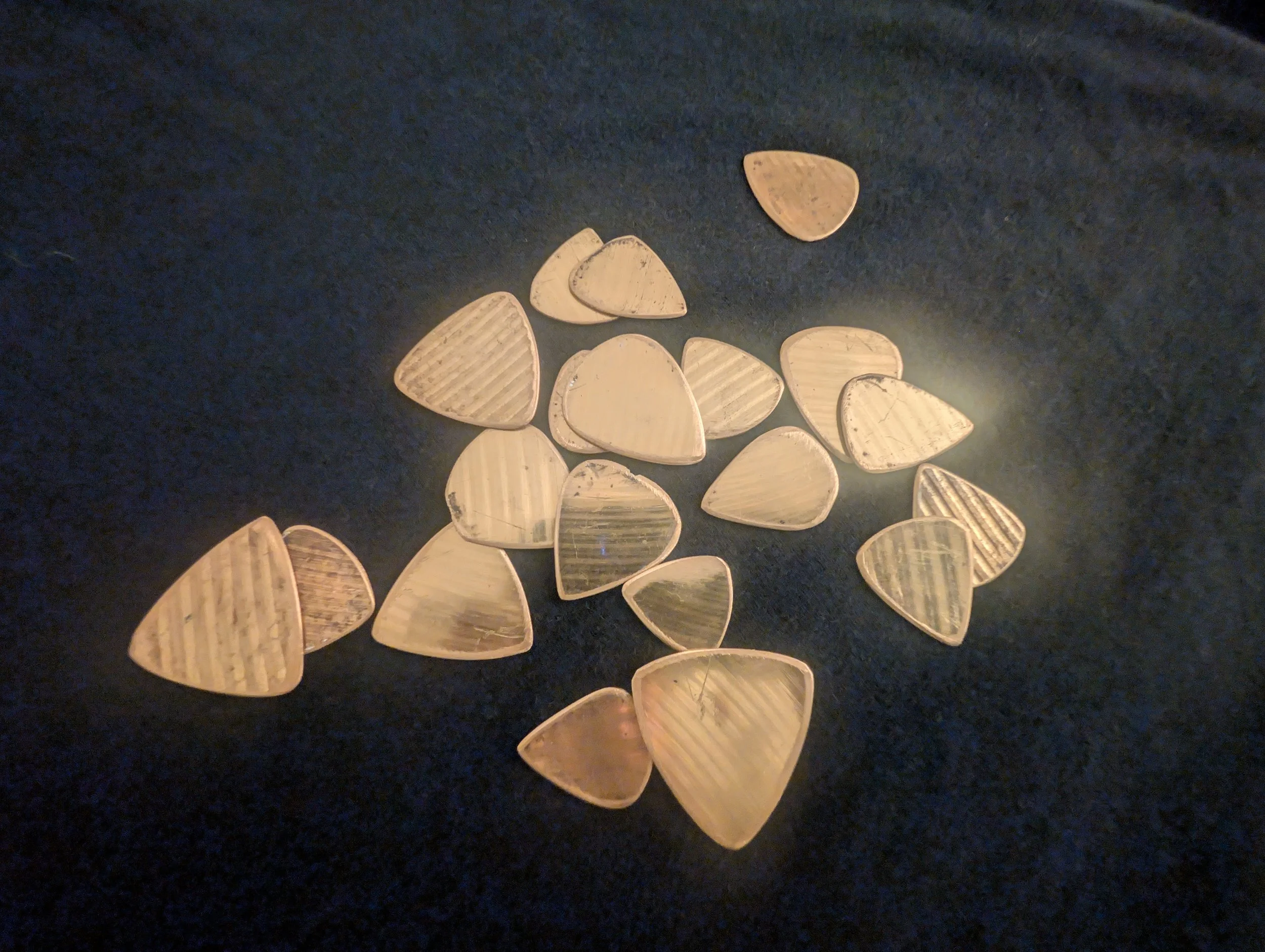 Assortment of Brass Cymbal Guitar Picks