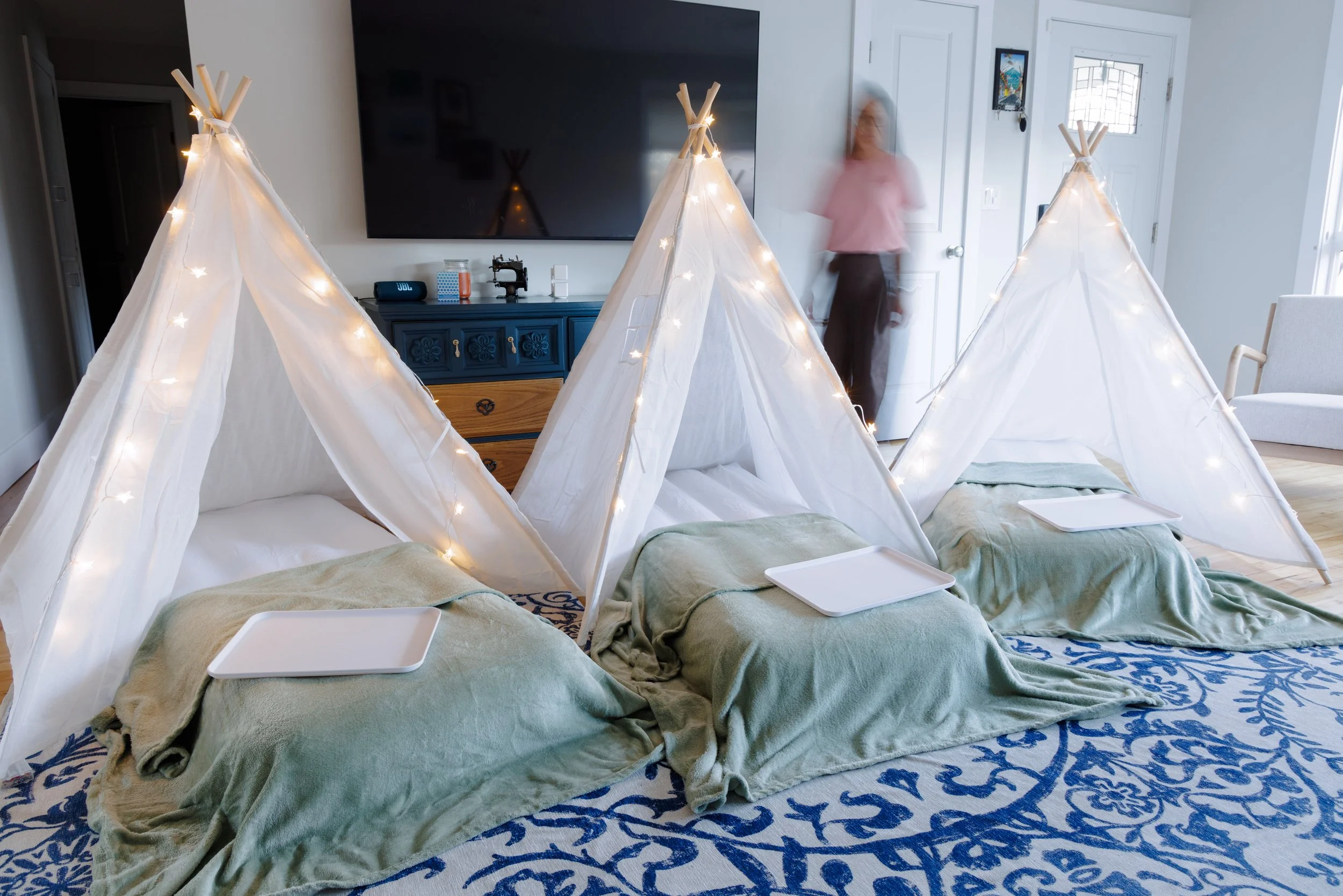 Sleepover party rental with tepee tent, inflatable mattress, blanket and lights