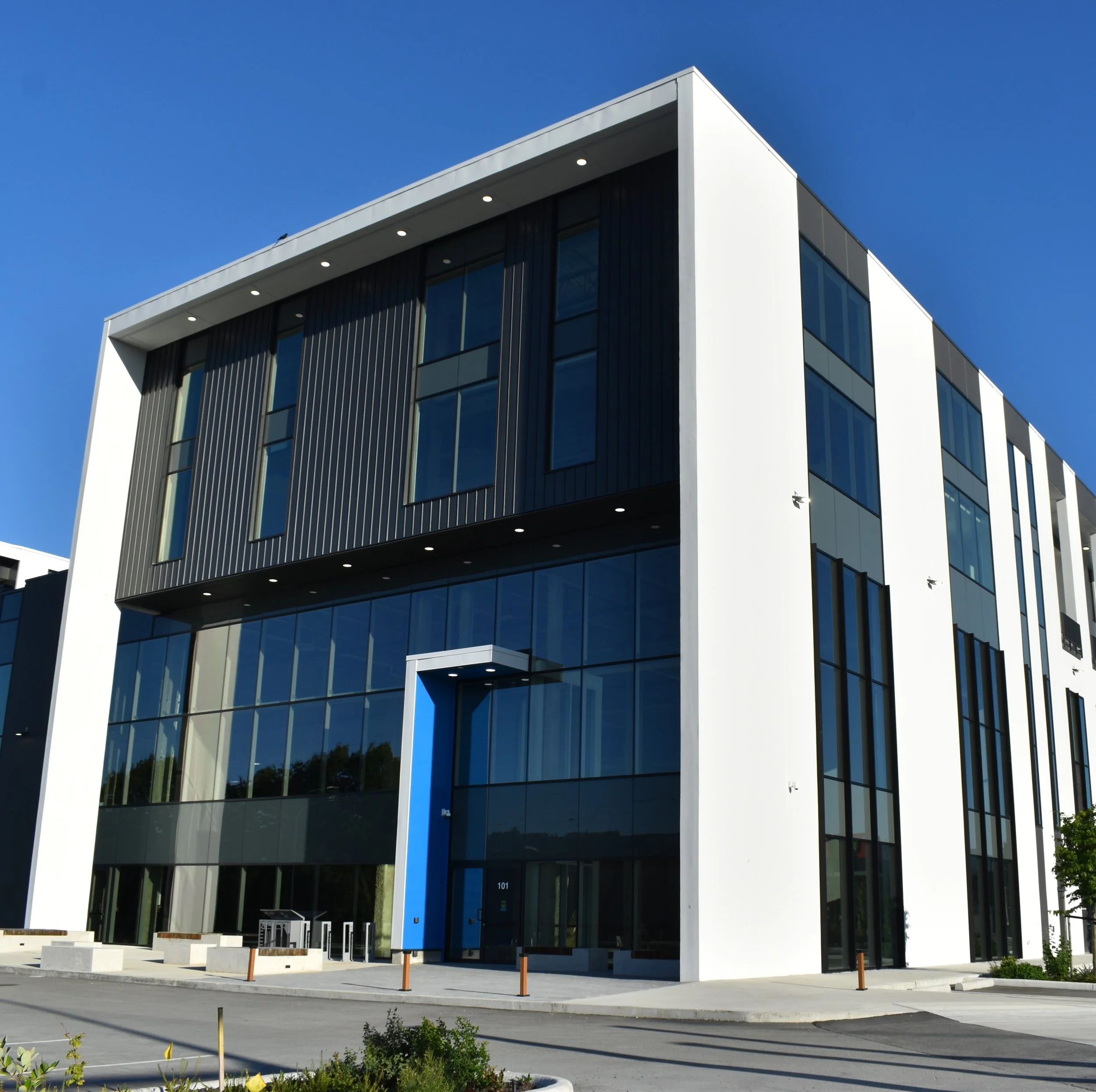 Commercial exterior cladding installation in Metro Vancouver with glass façade and panel systems by L2 Group